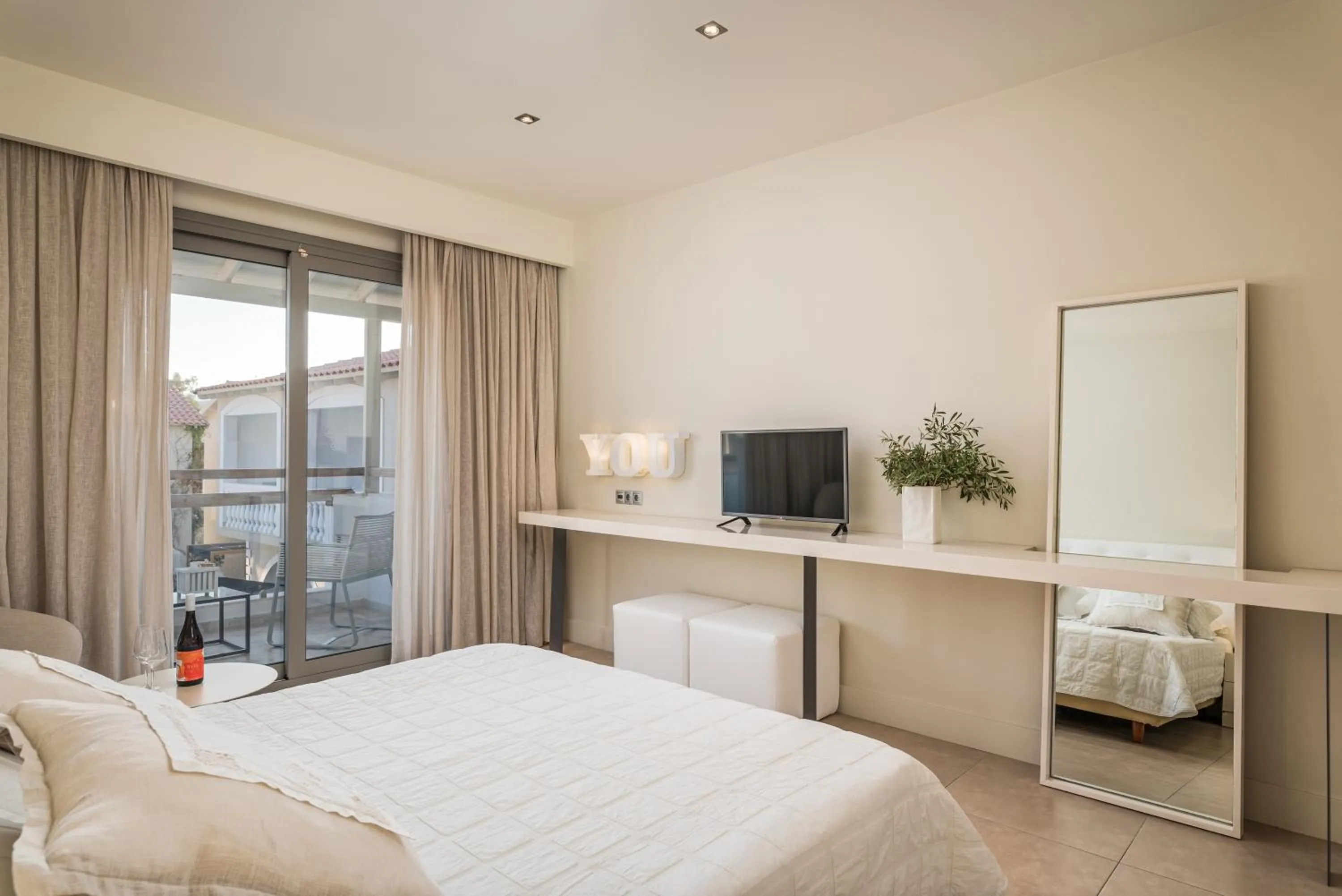 Bed in Ino Hotel & Suites