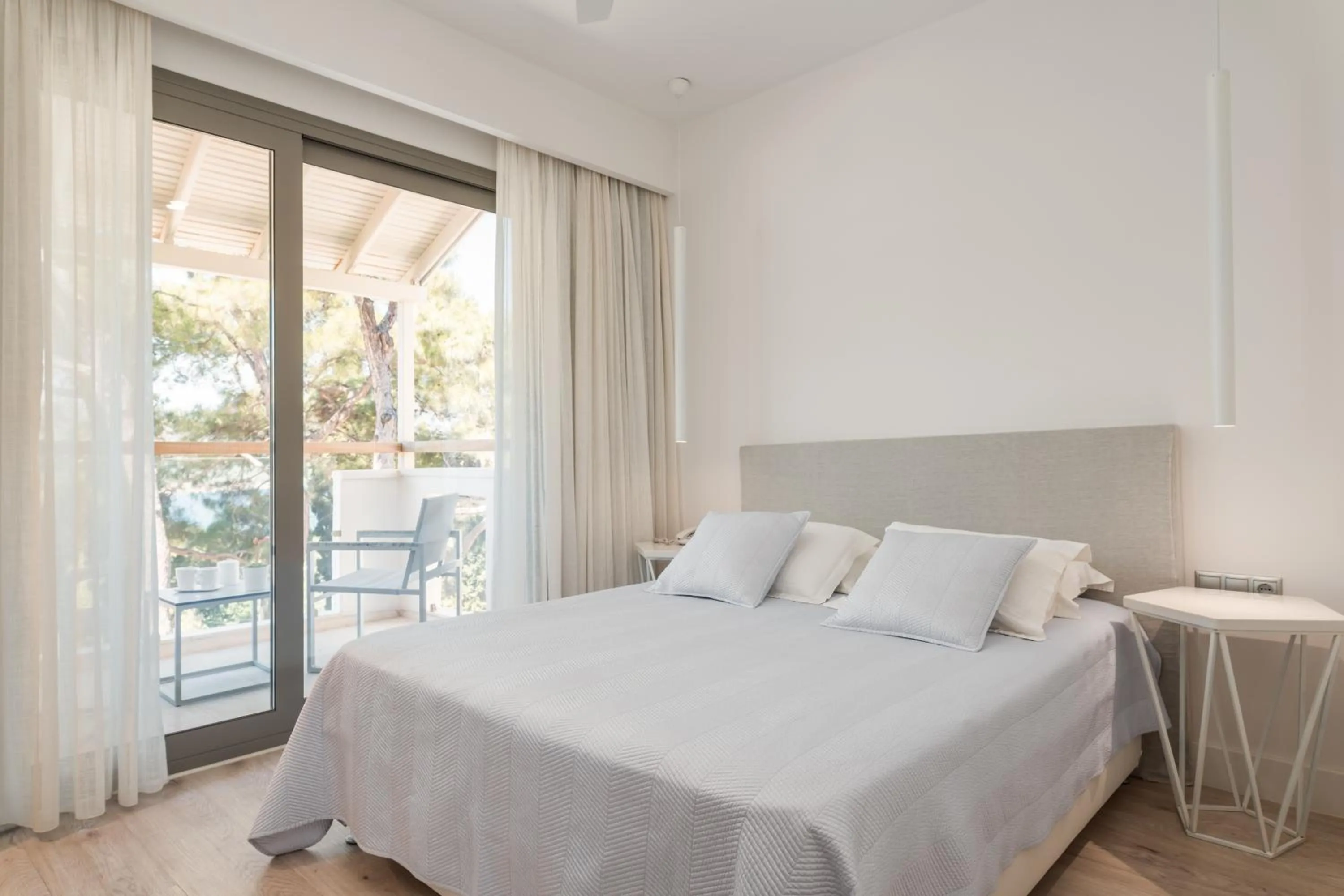 Bed in Ino Hotel & Suites