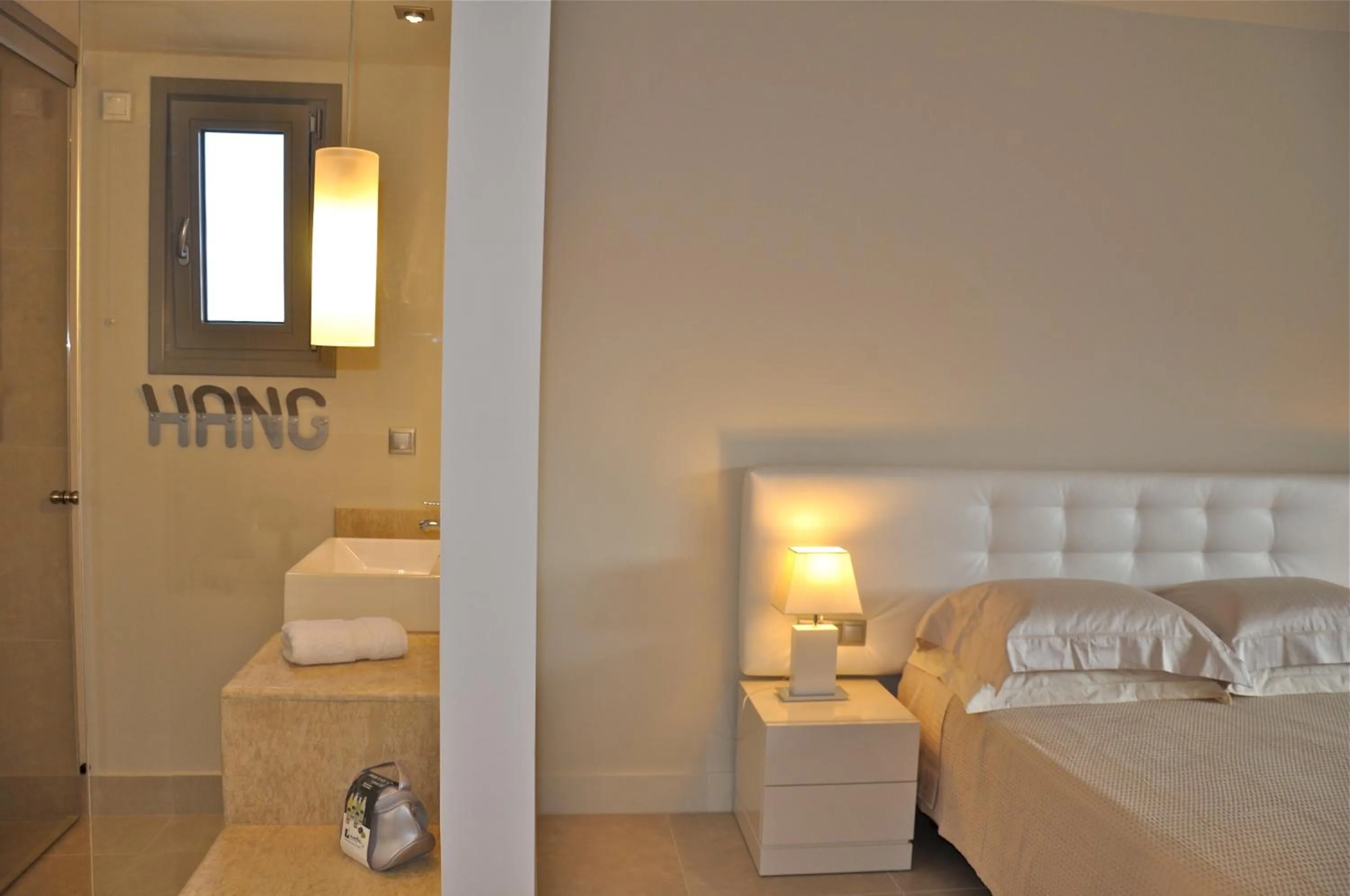 Bed in Ino Hotel & Suites