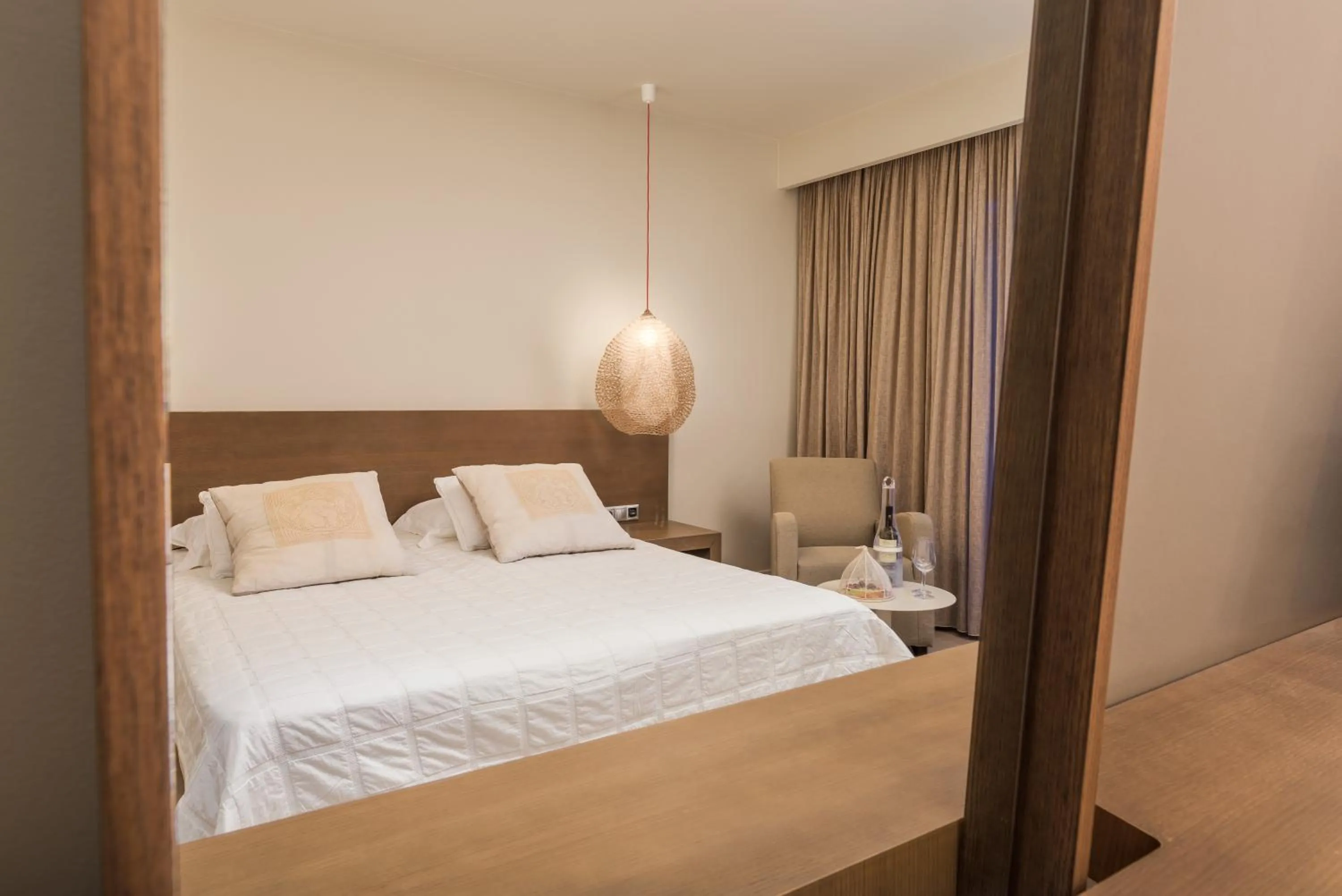 Bed in Ino Hotel & Suites