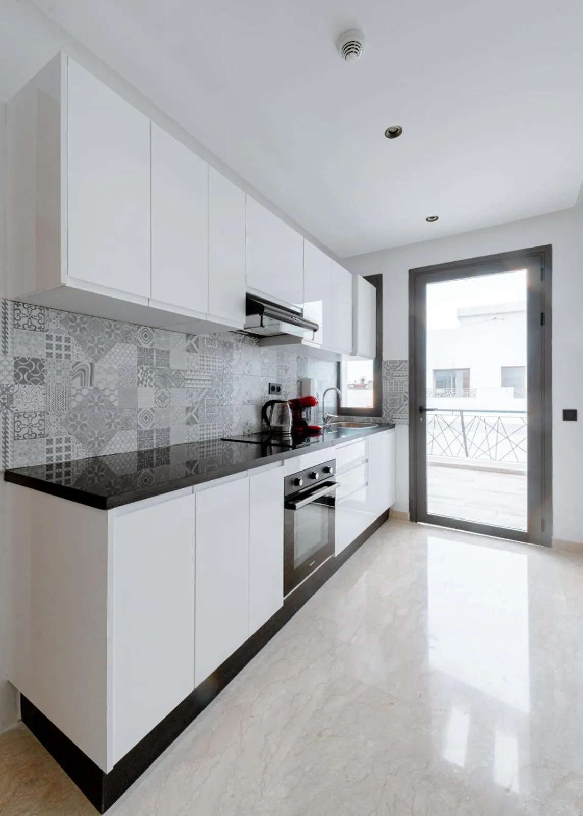 Kitchen or kitchenette in Spinoza House Appart Hôtel