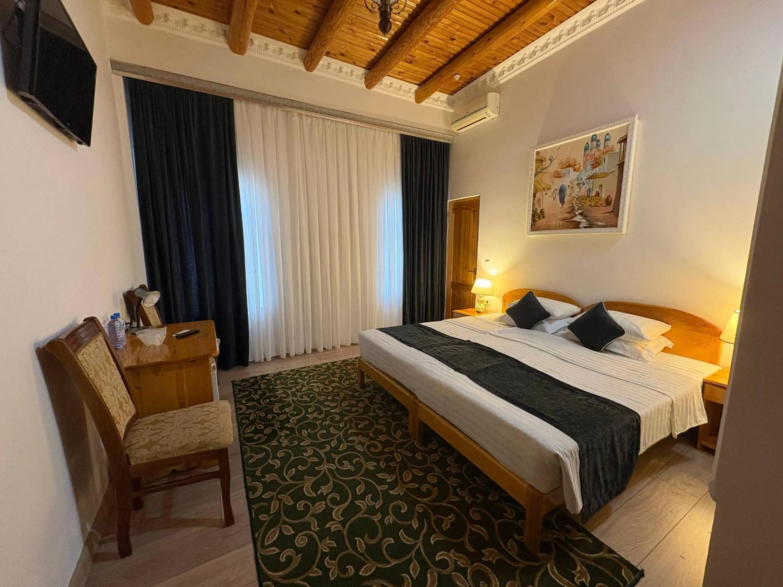 Bed in Porso Boutique Hotel