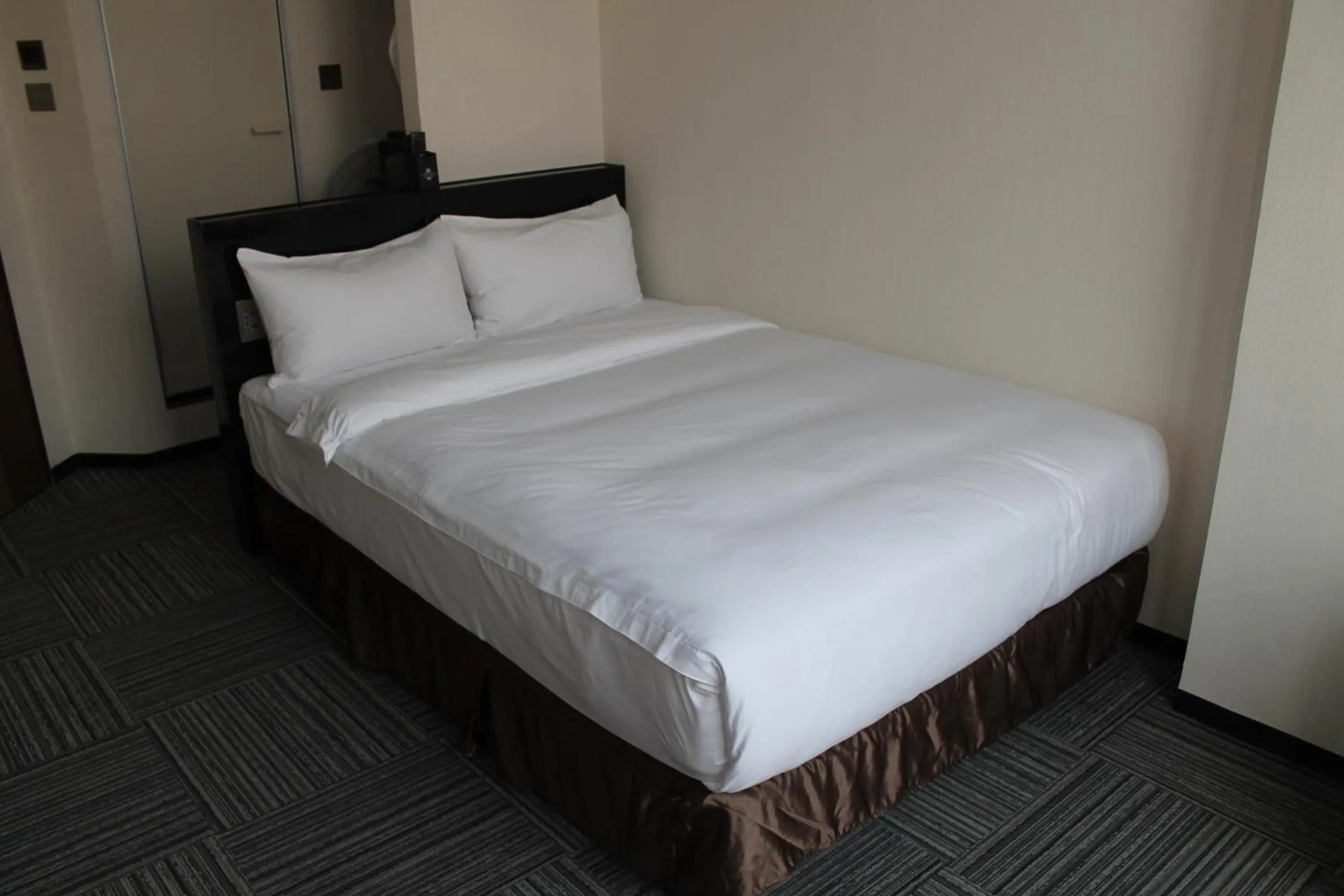 Bed in Sakura Hotel 2