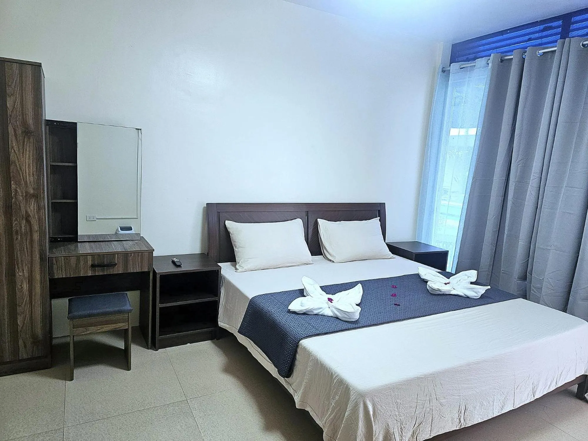 Bed in Mangotree Apartel & Resort