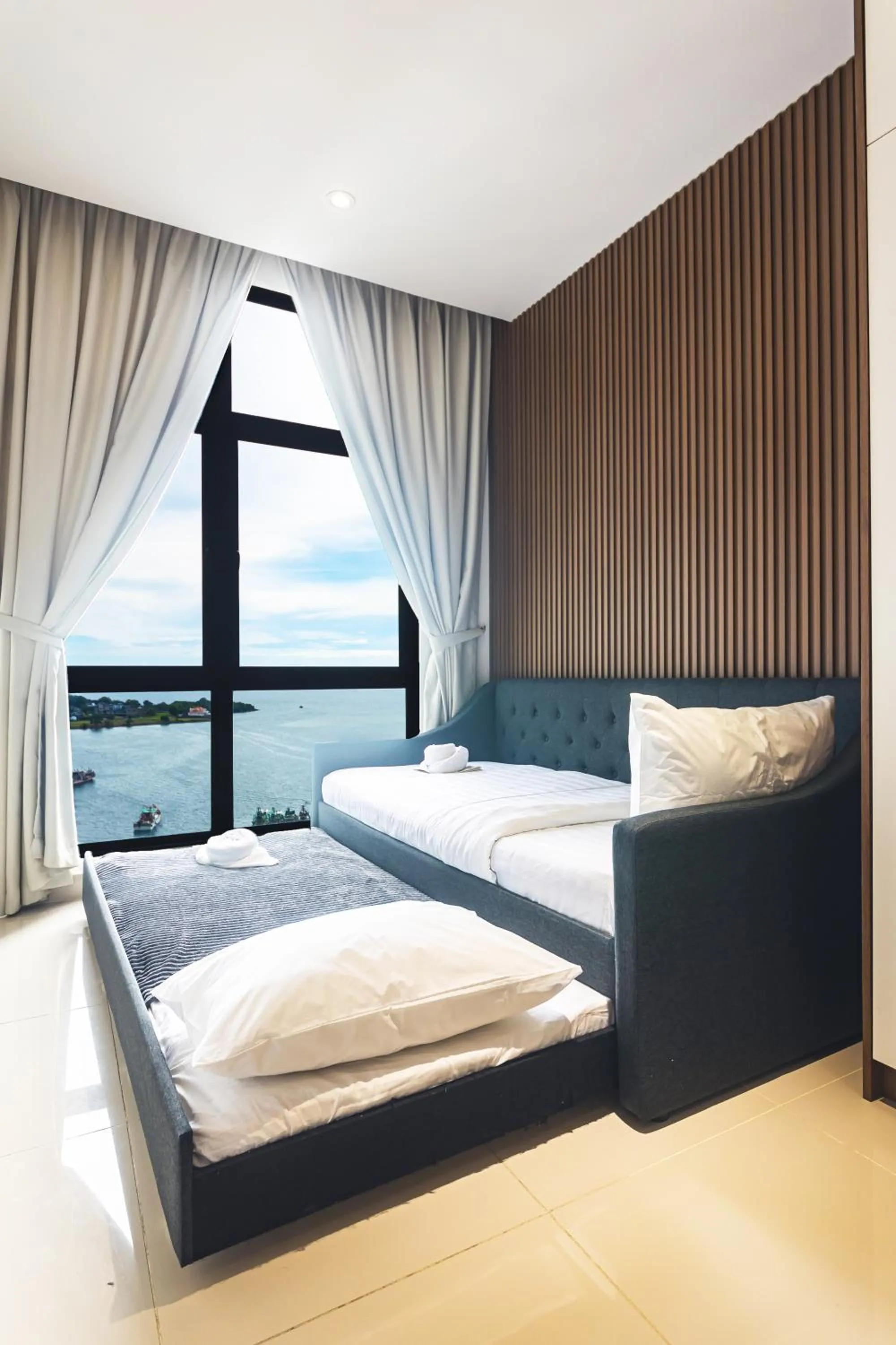 Bed in 5StarPanda Seaview Suites at The Shore Kota Kinabalu