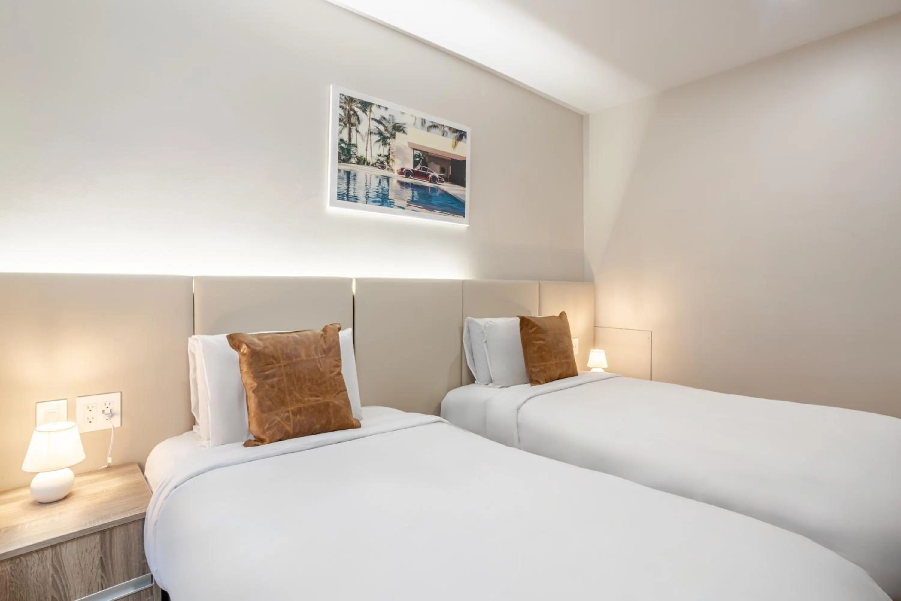 Bed in Olympia Hotel by Lodgo