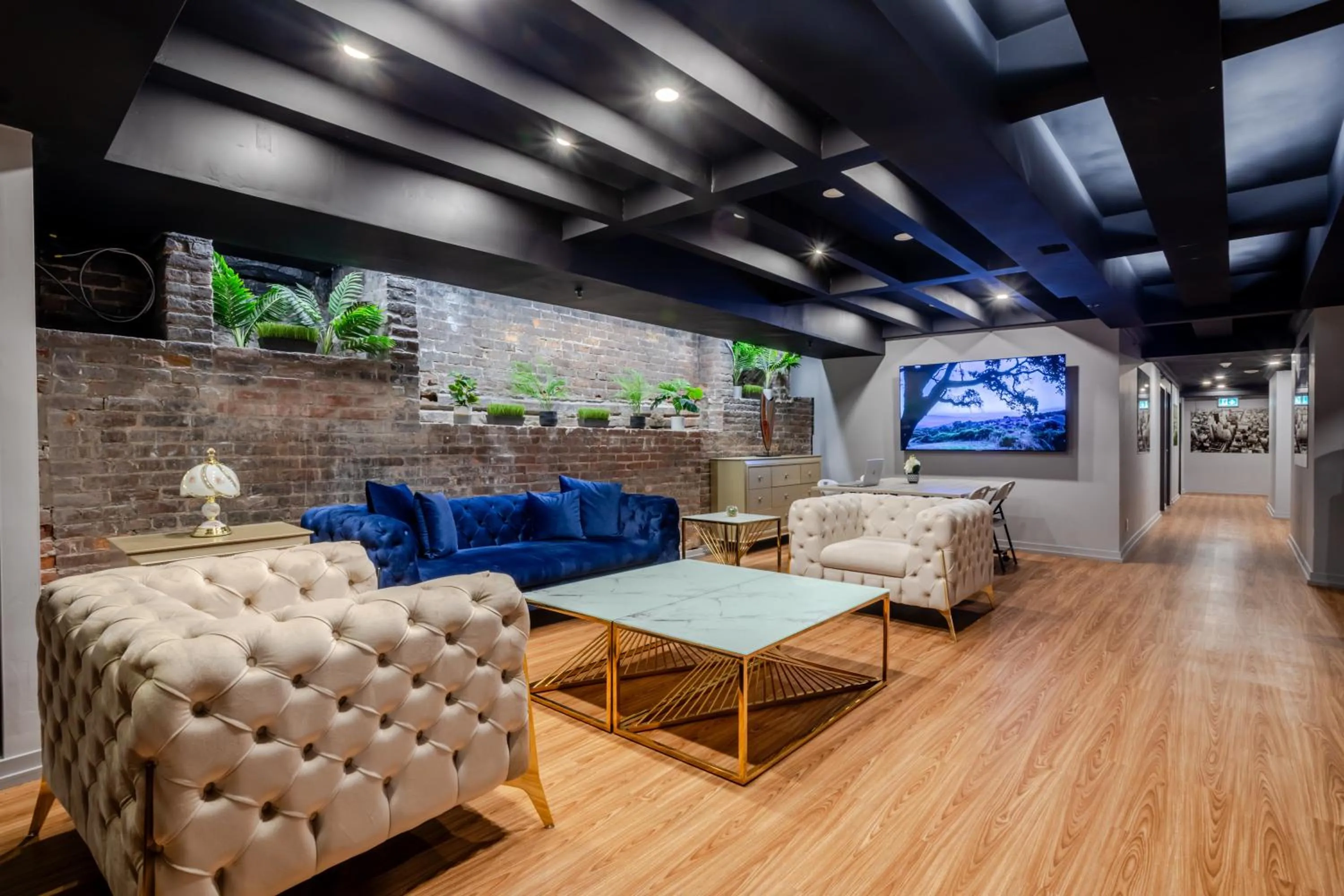 Communal lounge/ TV room in Olympia Hotel by Lodgo