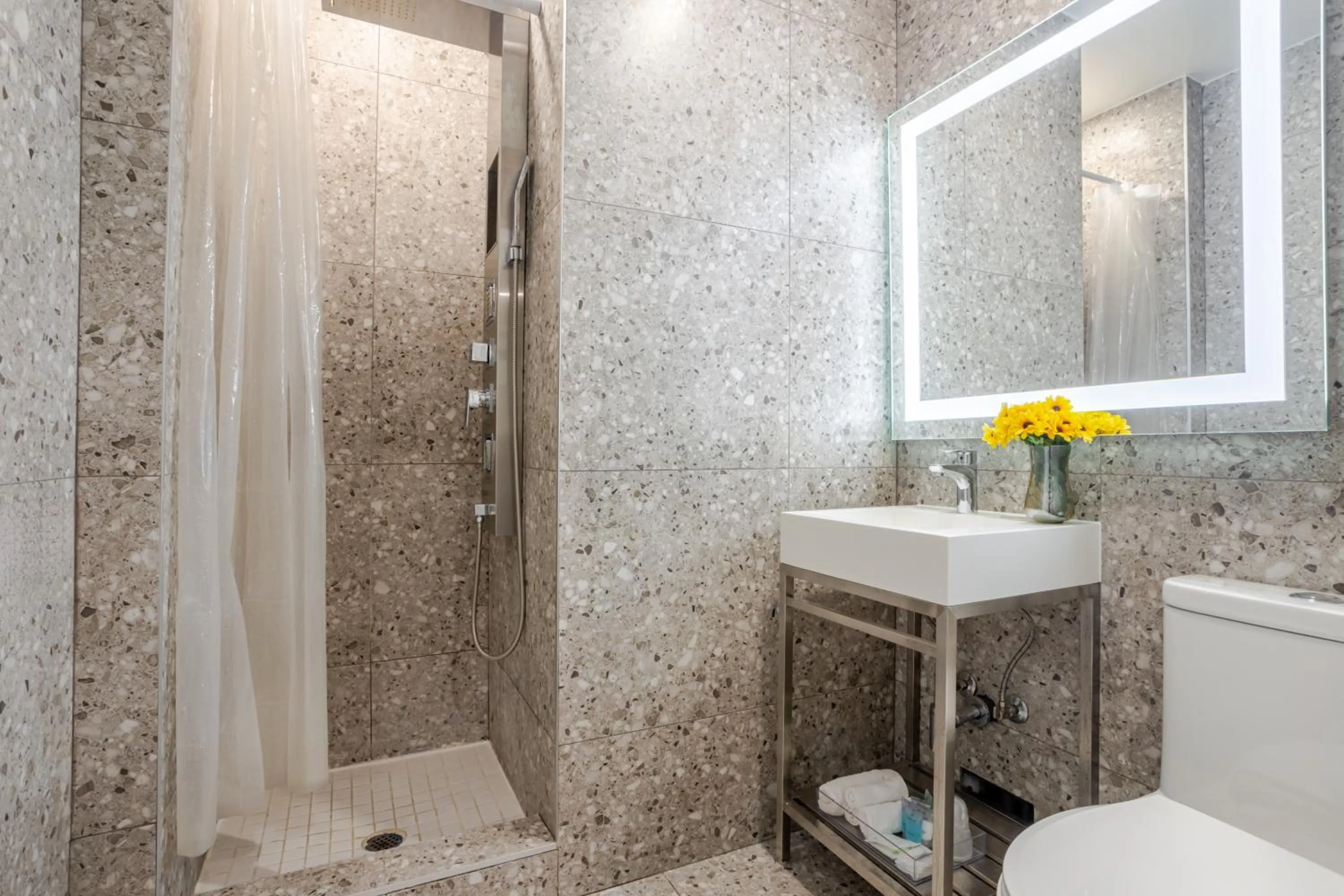 Shower in Olympia Hotel by Lodgo