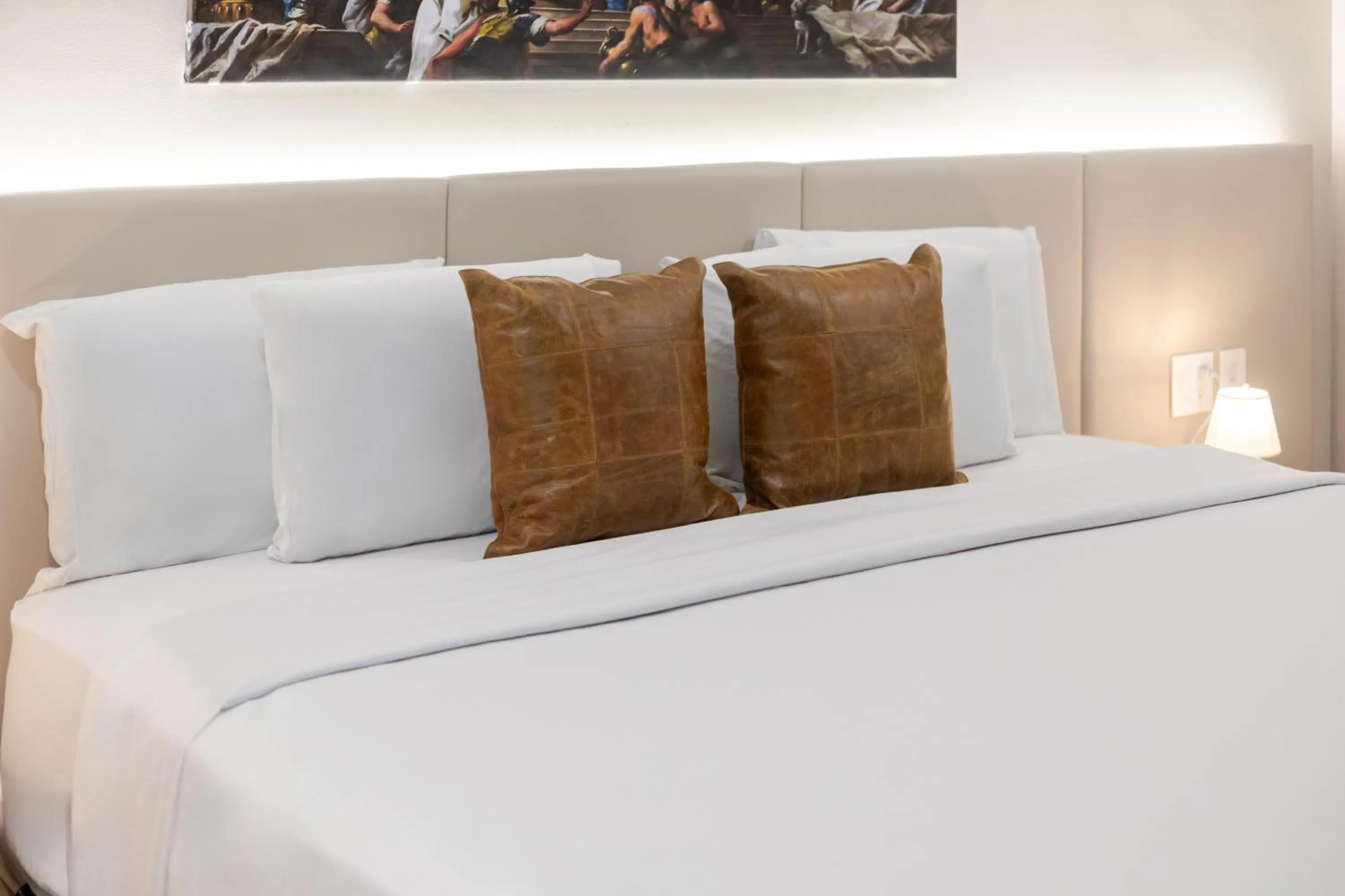 Bed in Olympia Hotel by Lodgo
