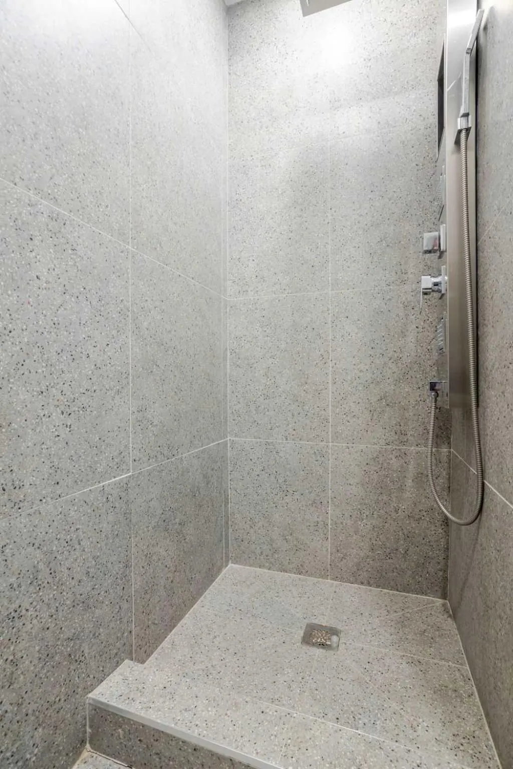 Shower in Olympia Hotel by Lodgo
