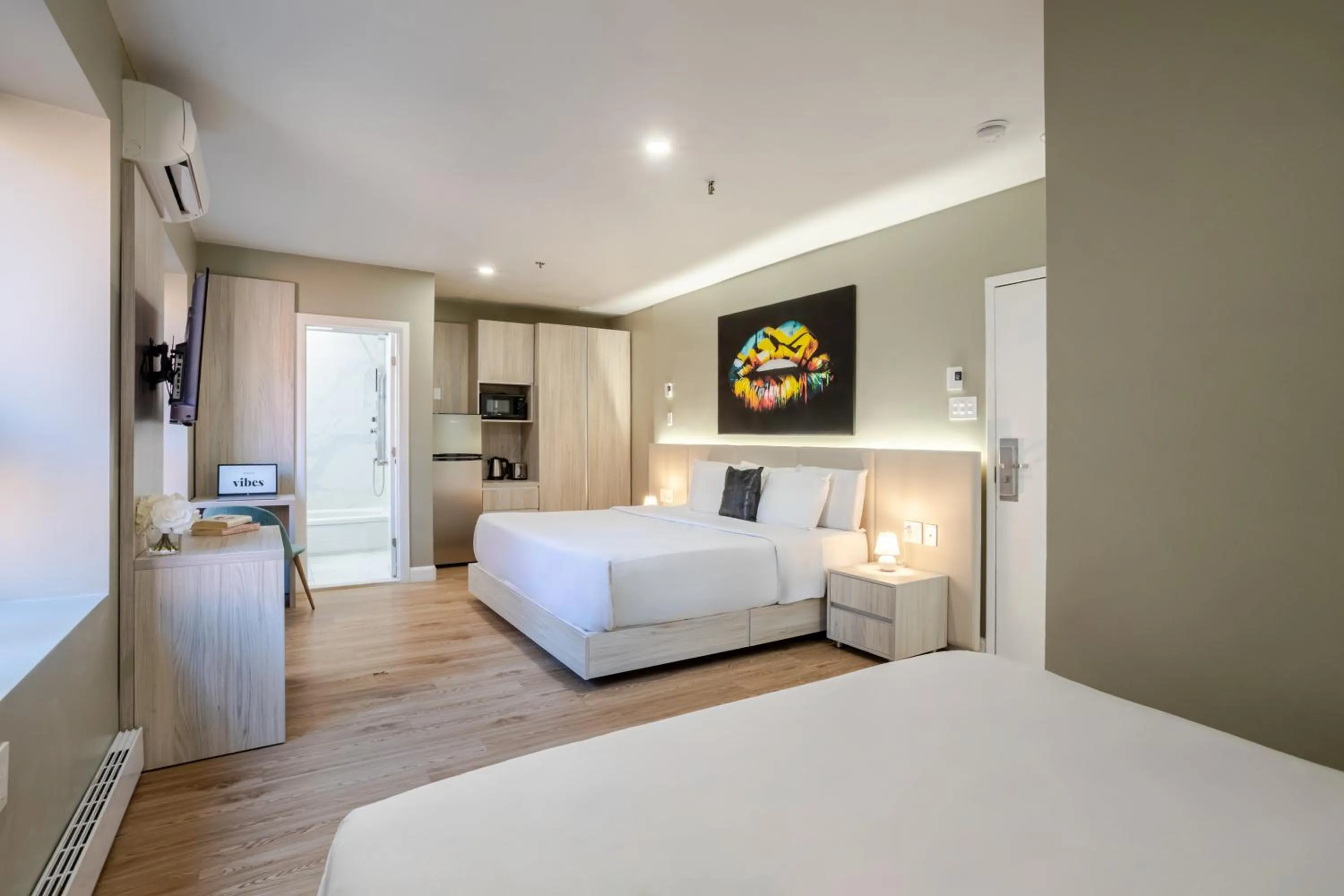 Bed in Olympia Hotel by Lodgo