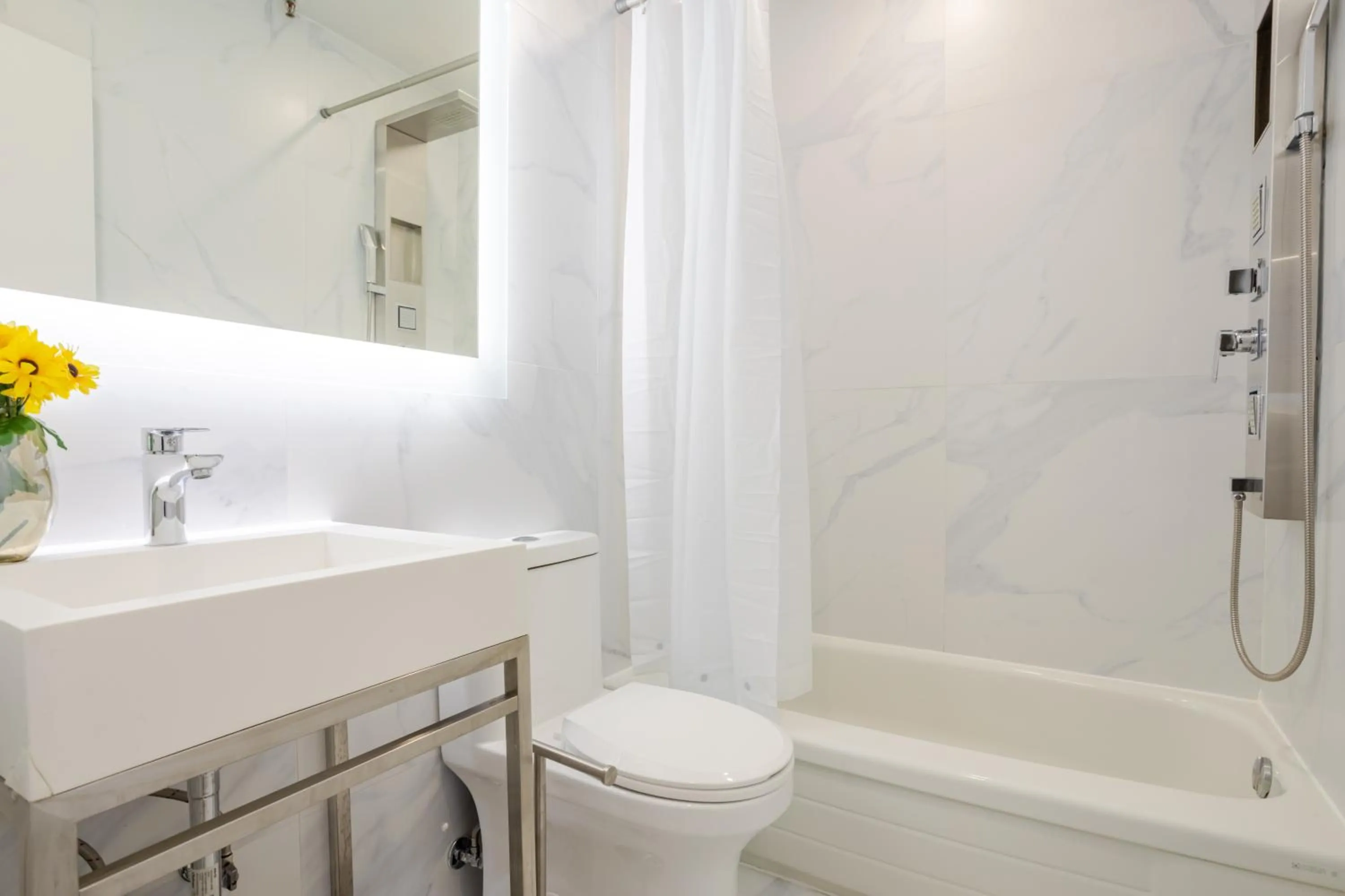 Shower in Olympia Hotel by Lodgo