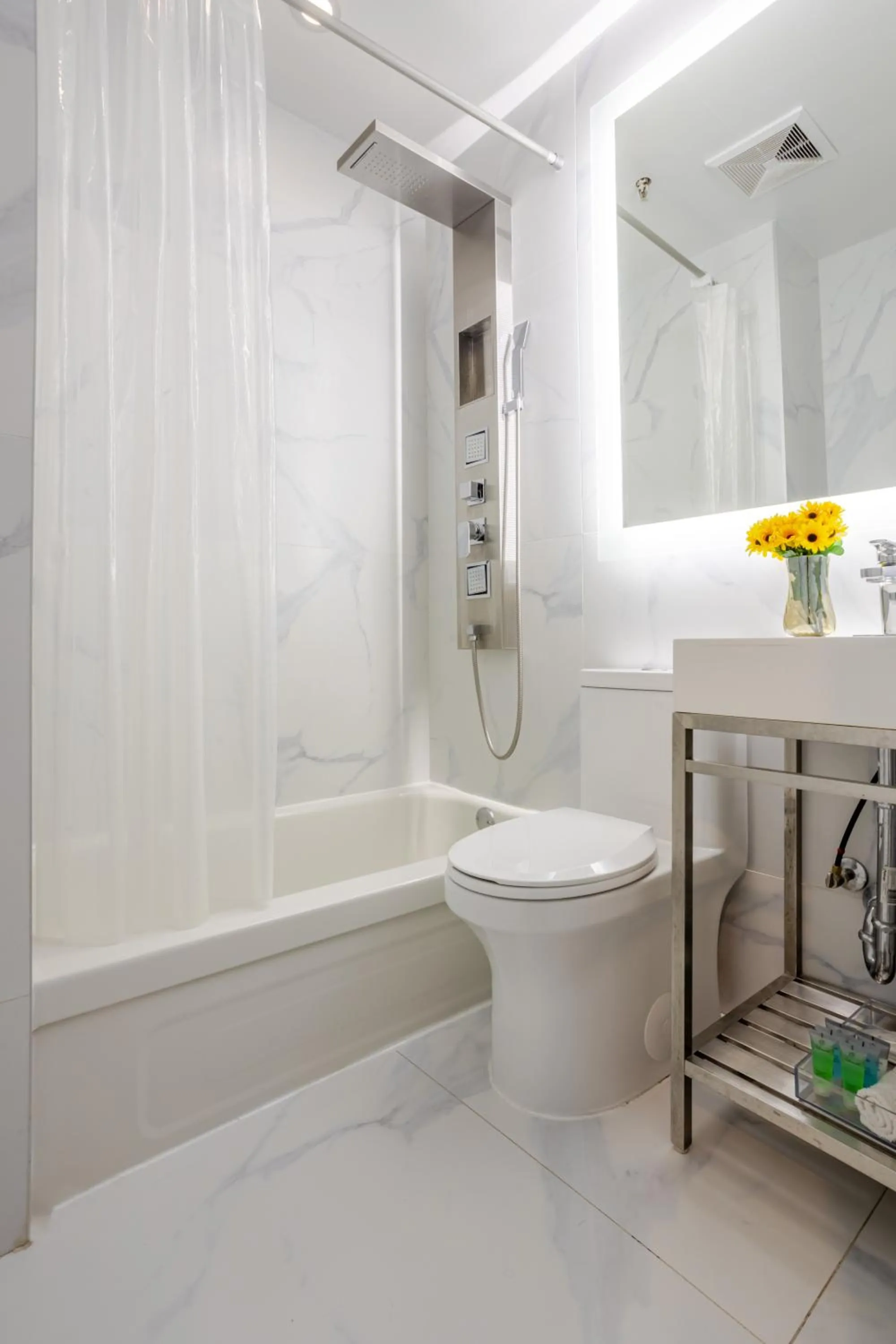 Bathroom in Olympia Hotel by Lodgo