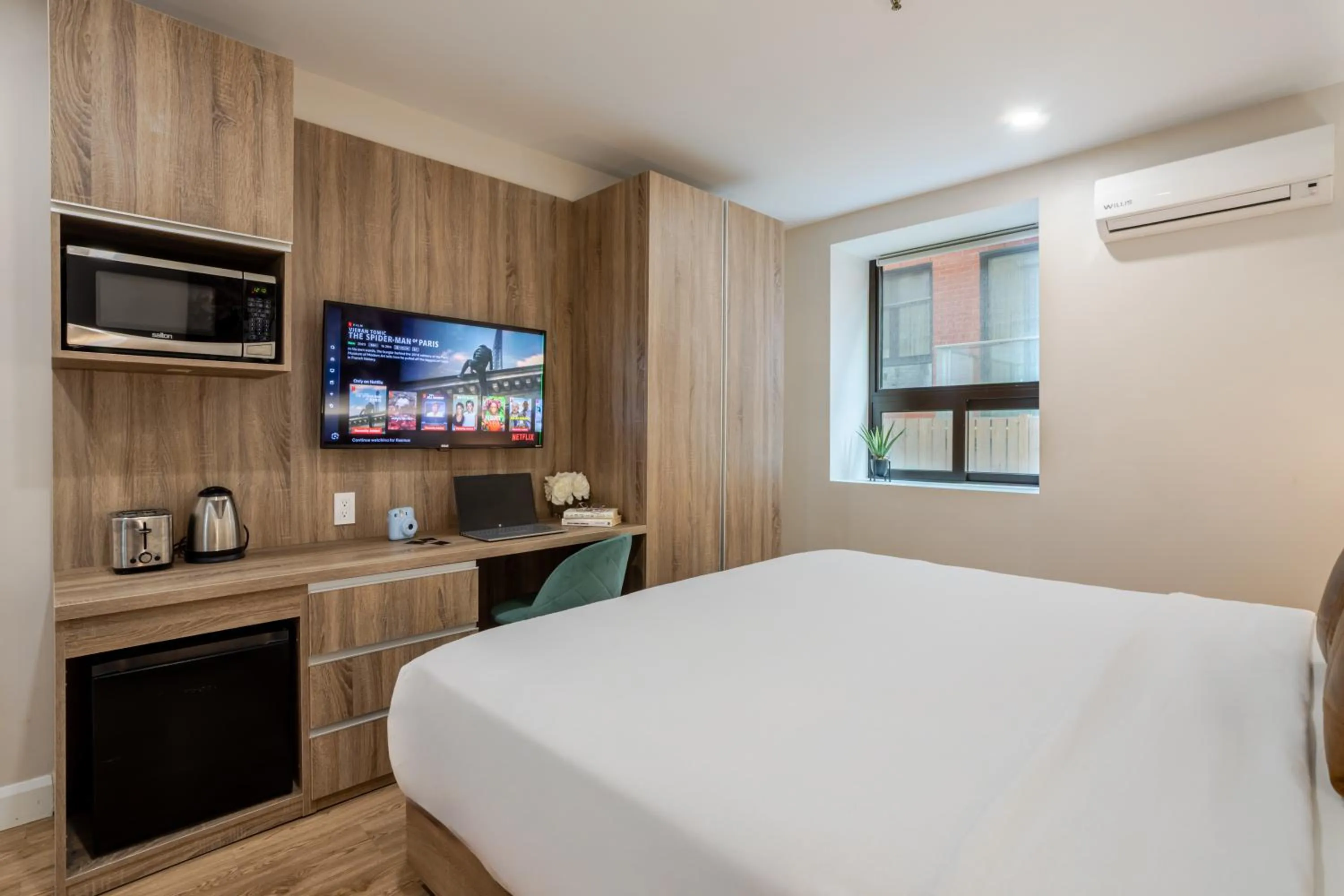 Bed in Olympia Hotel by Lodgo