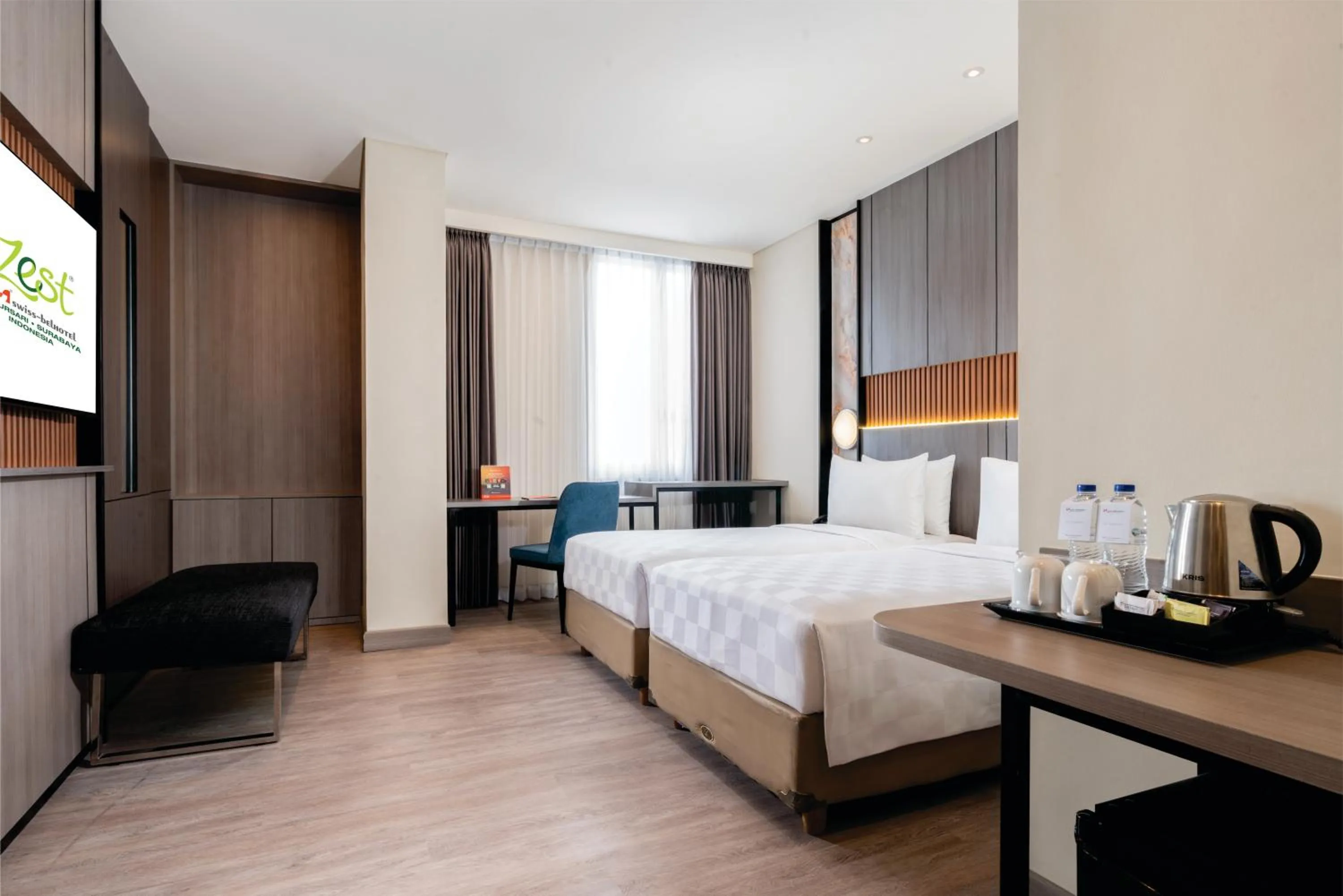 Bed in Zest Jemursari by Swiss-Belhotel International