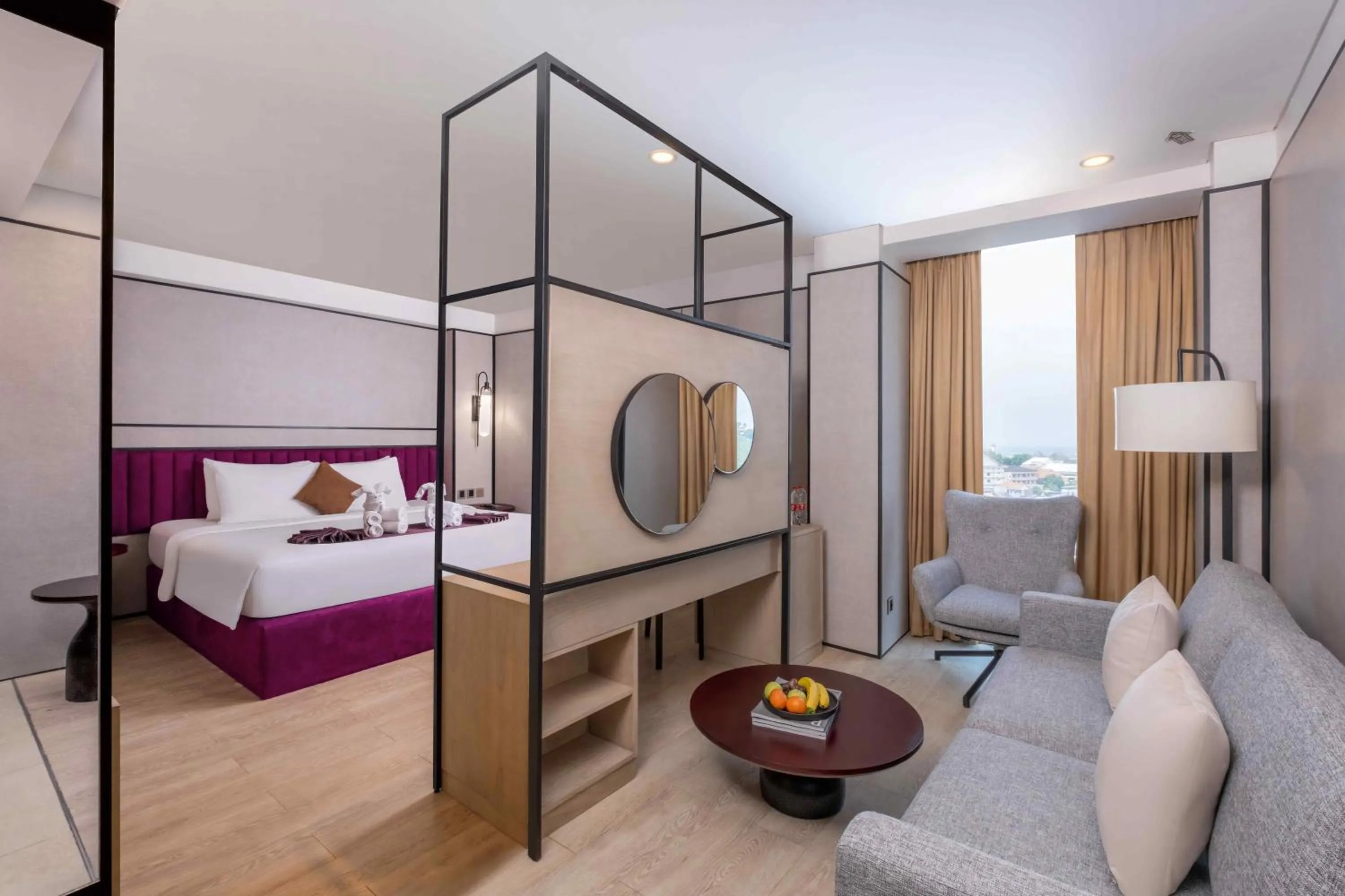 Living room, Bed in Grand Edge Hotel Semarang