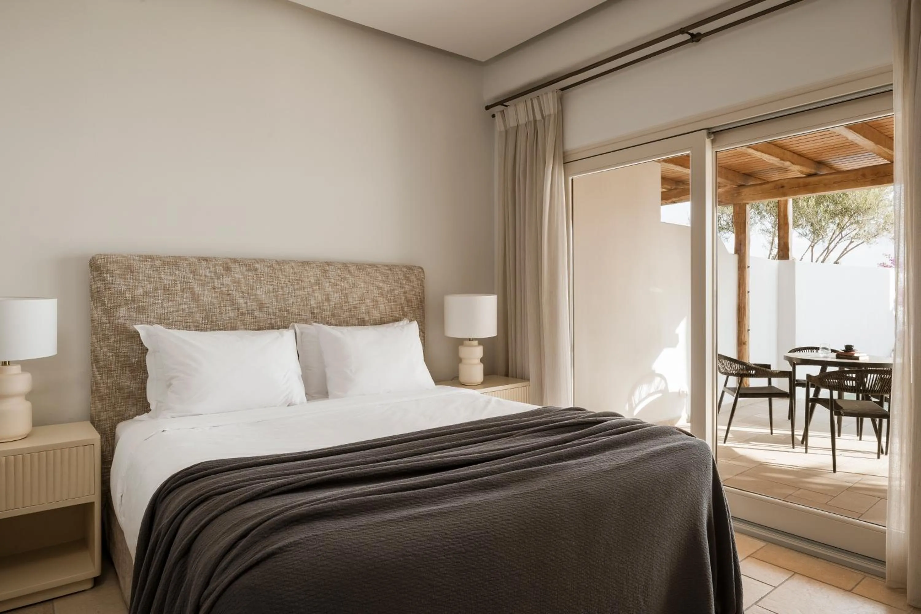 Patio, Bed in AMĀRIA Beach Resort by NOMÉE Hospitality Group