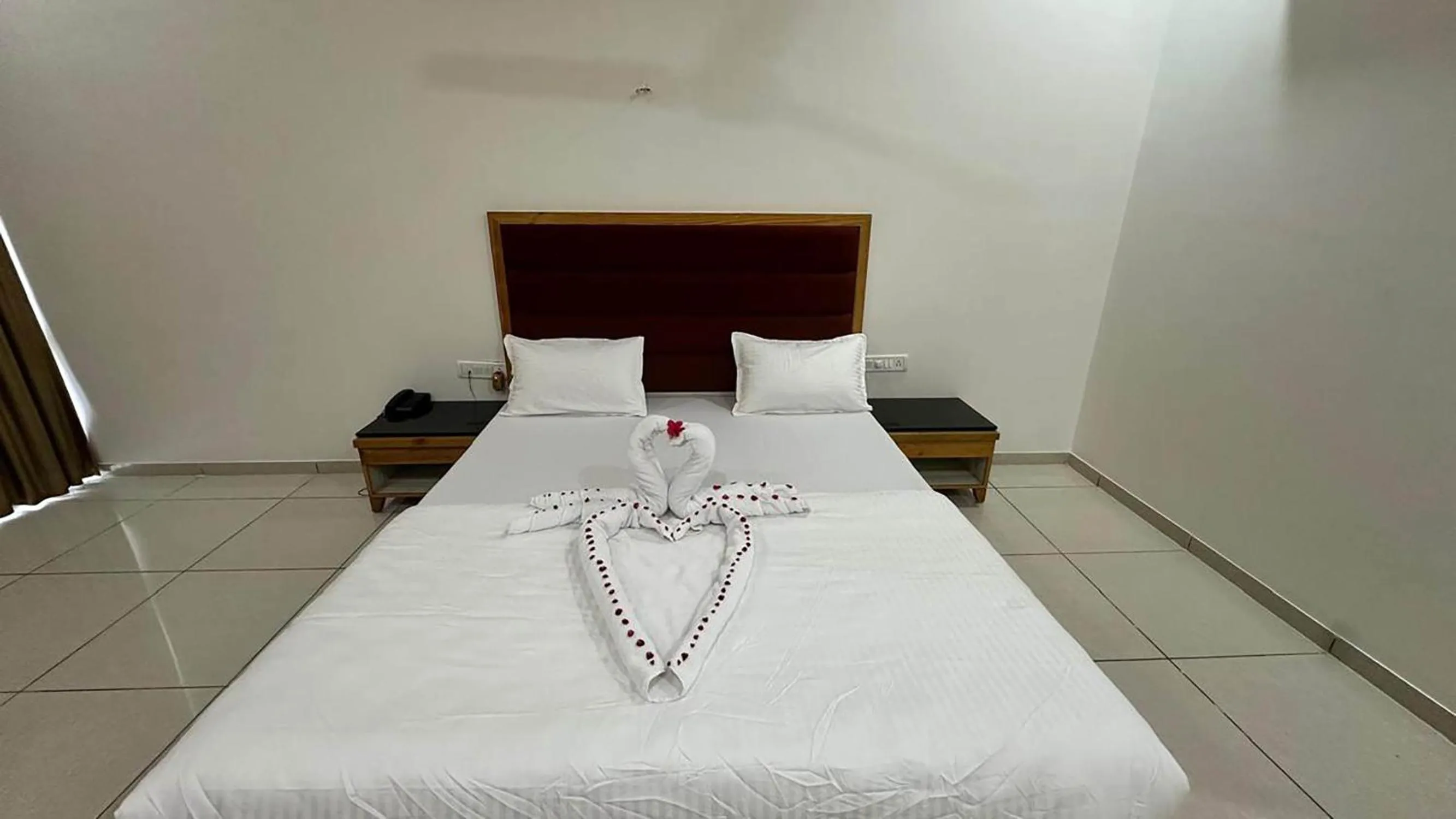 Bed in Bansari Greens Resort