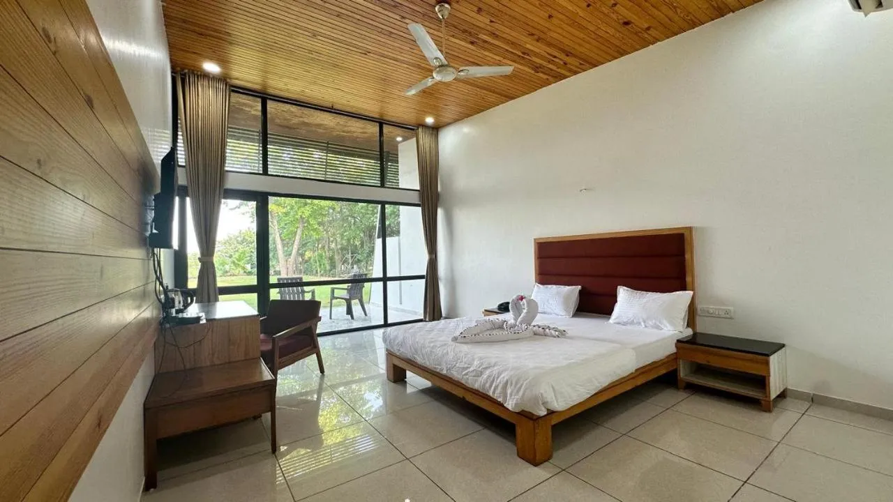 Bed in Bansari Greens Resort