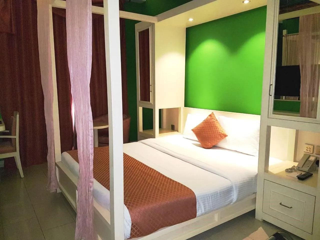 Bed in Reflections Hotel