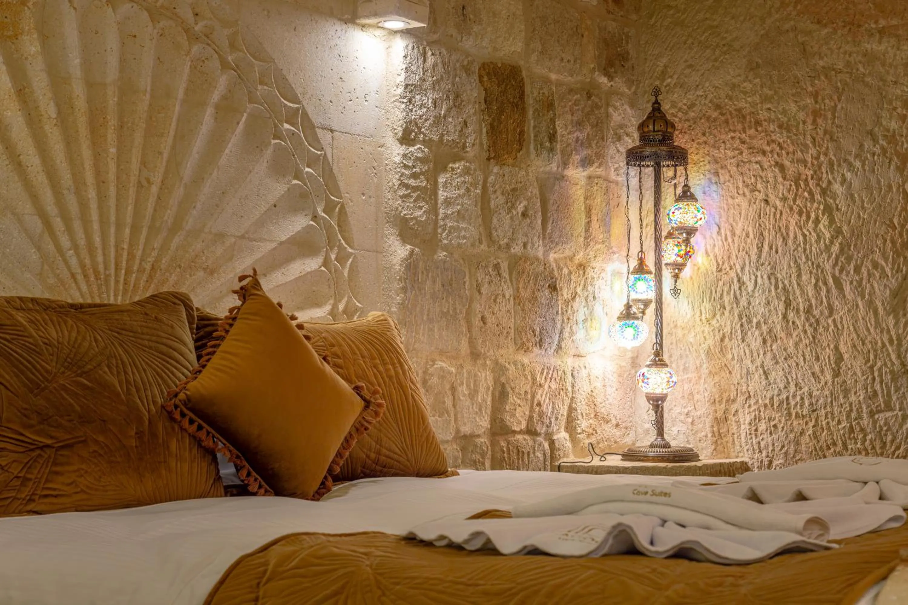 Bed in Lagoon Cave Suites