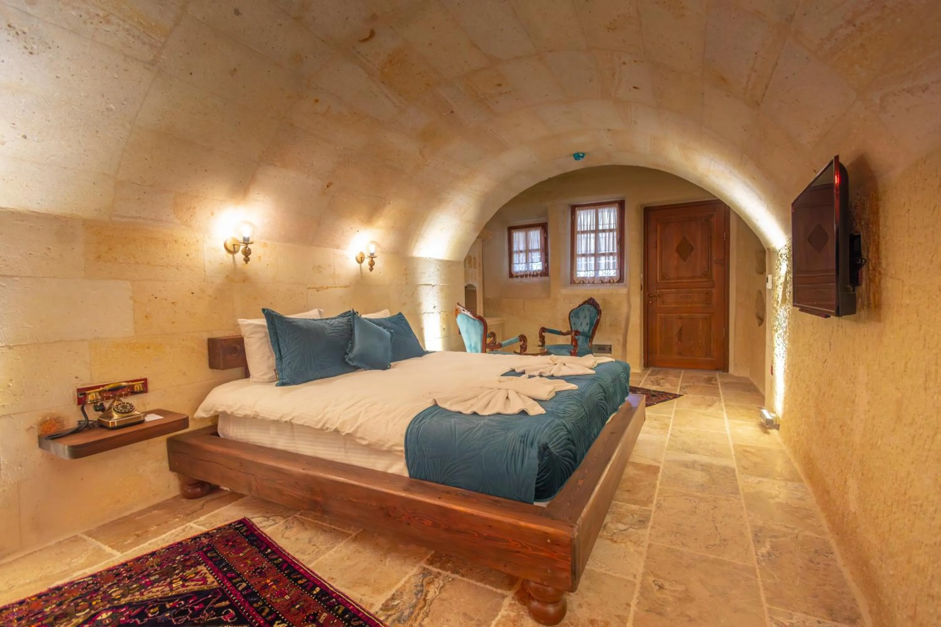 Bed in Lagoon Cave Suites