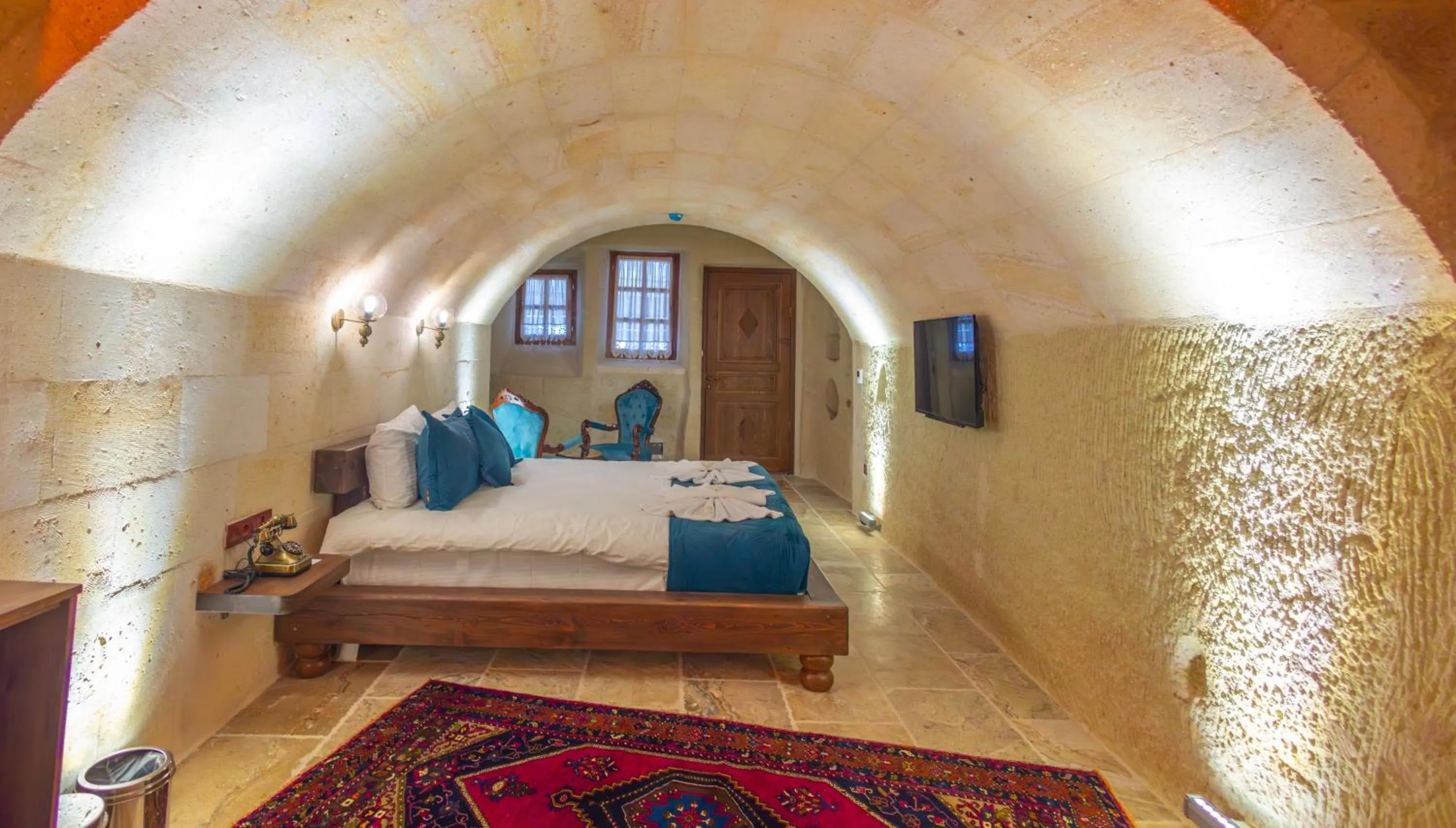 Bed in Lagoon Cave Suites