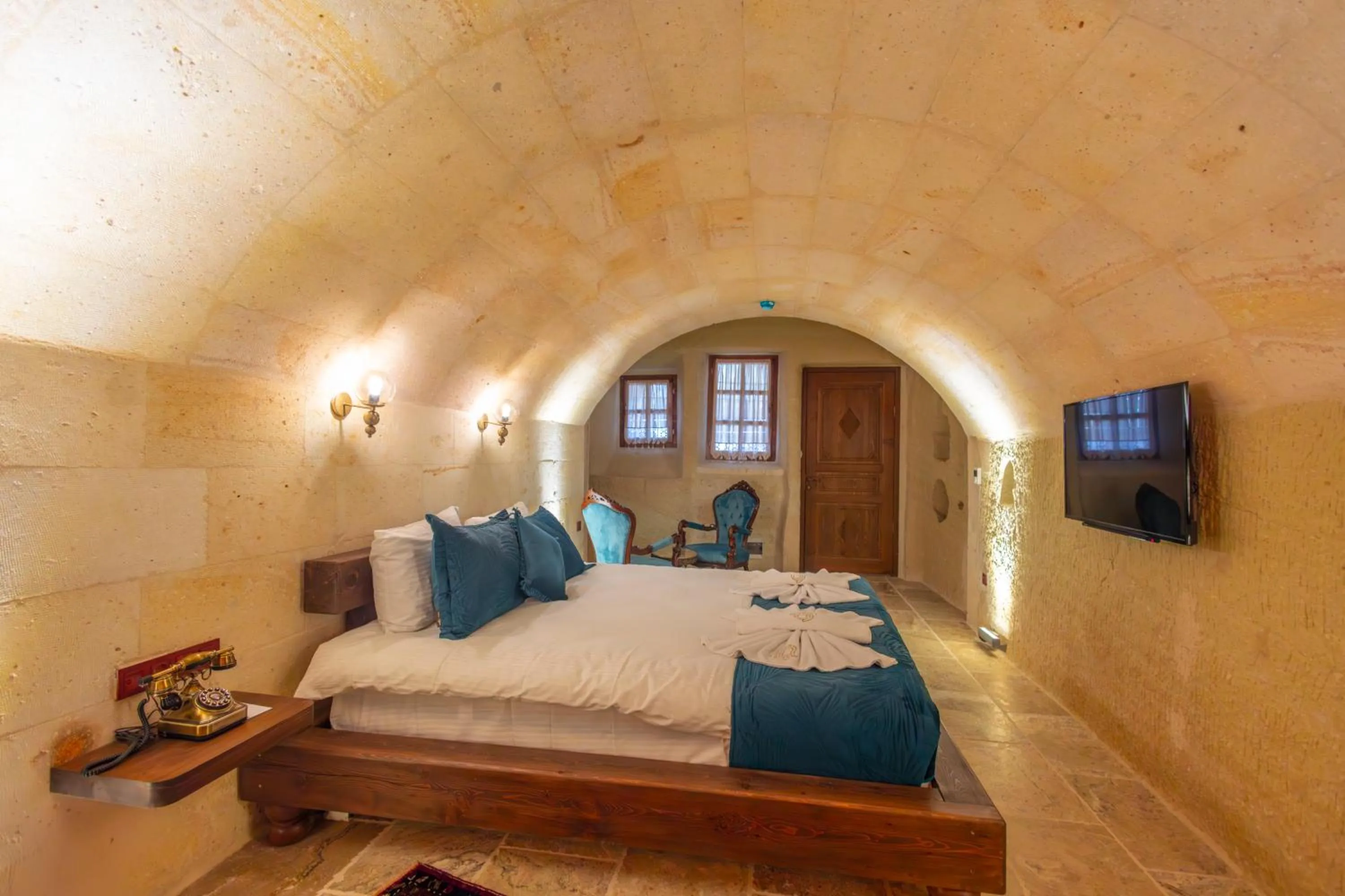 Bed in Lagoon Cave Suites