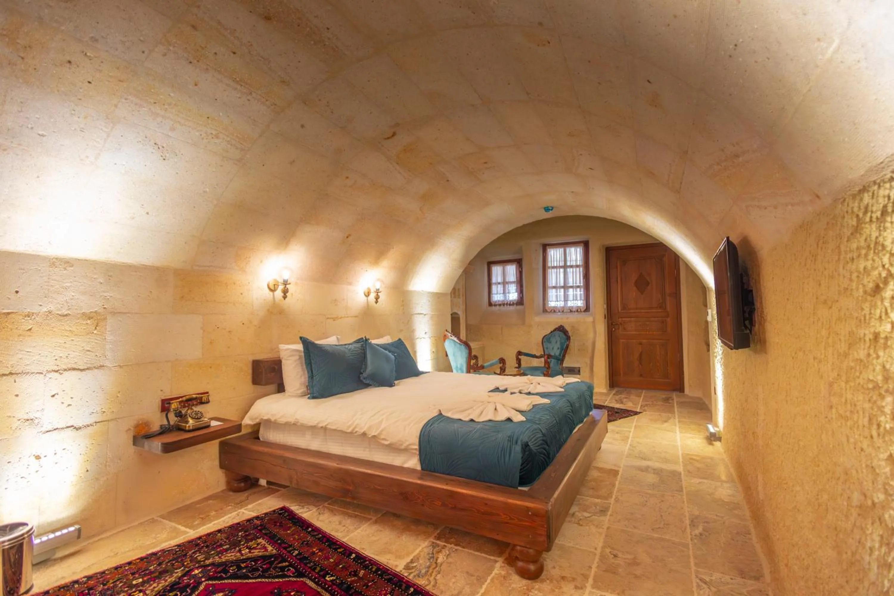 Bed in Lagoon Cave Suites