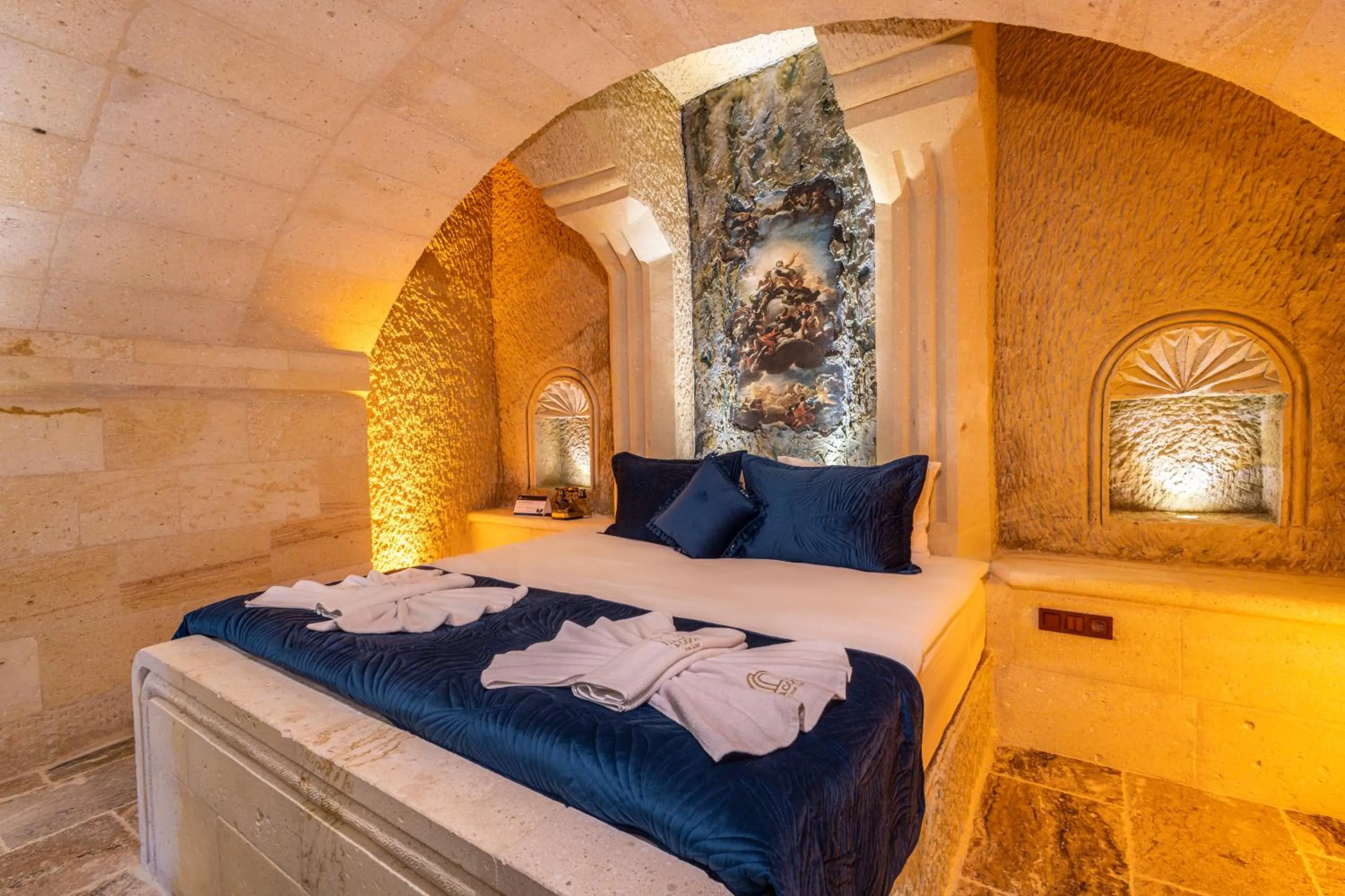 Bed in Lagoon Cave Suites