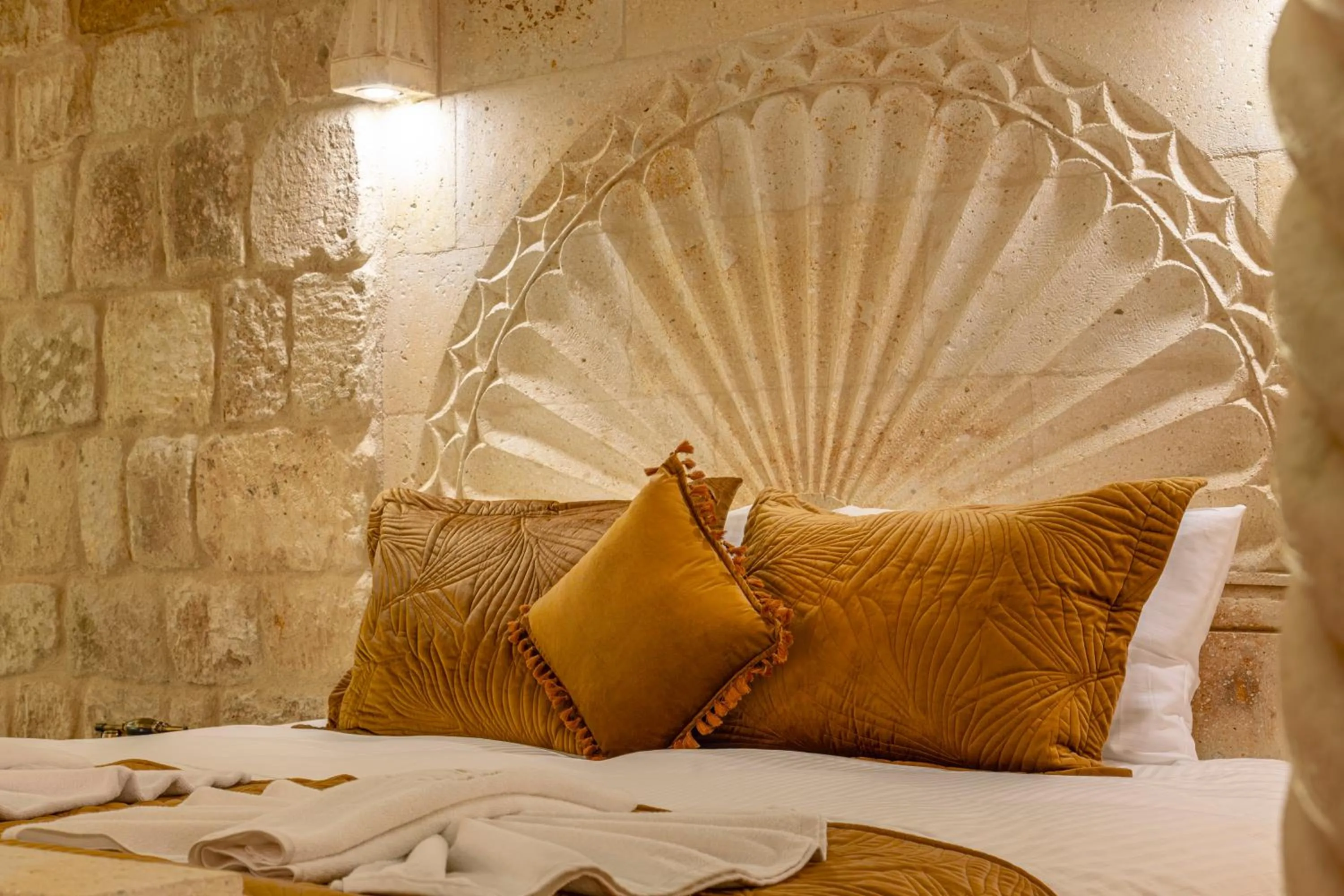 Bed in Lagoon Cave Suites