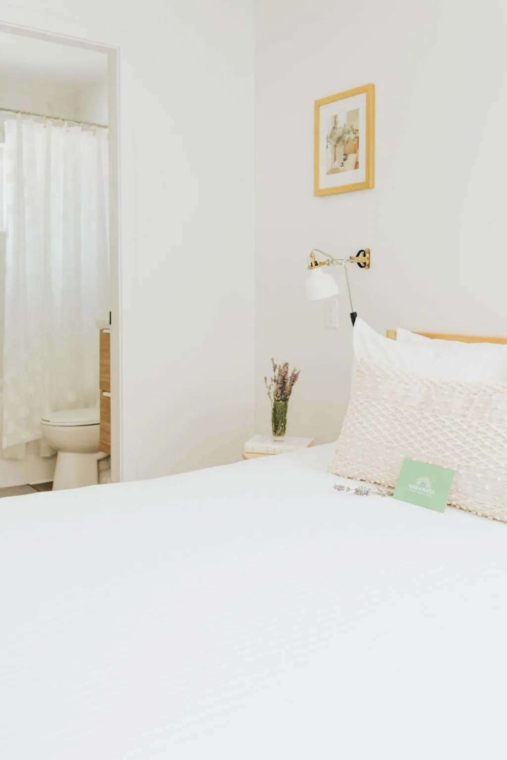 Bed in Naramata Courtyard Suites