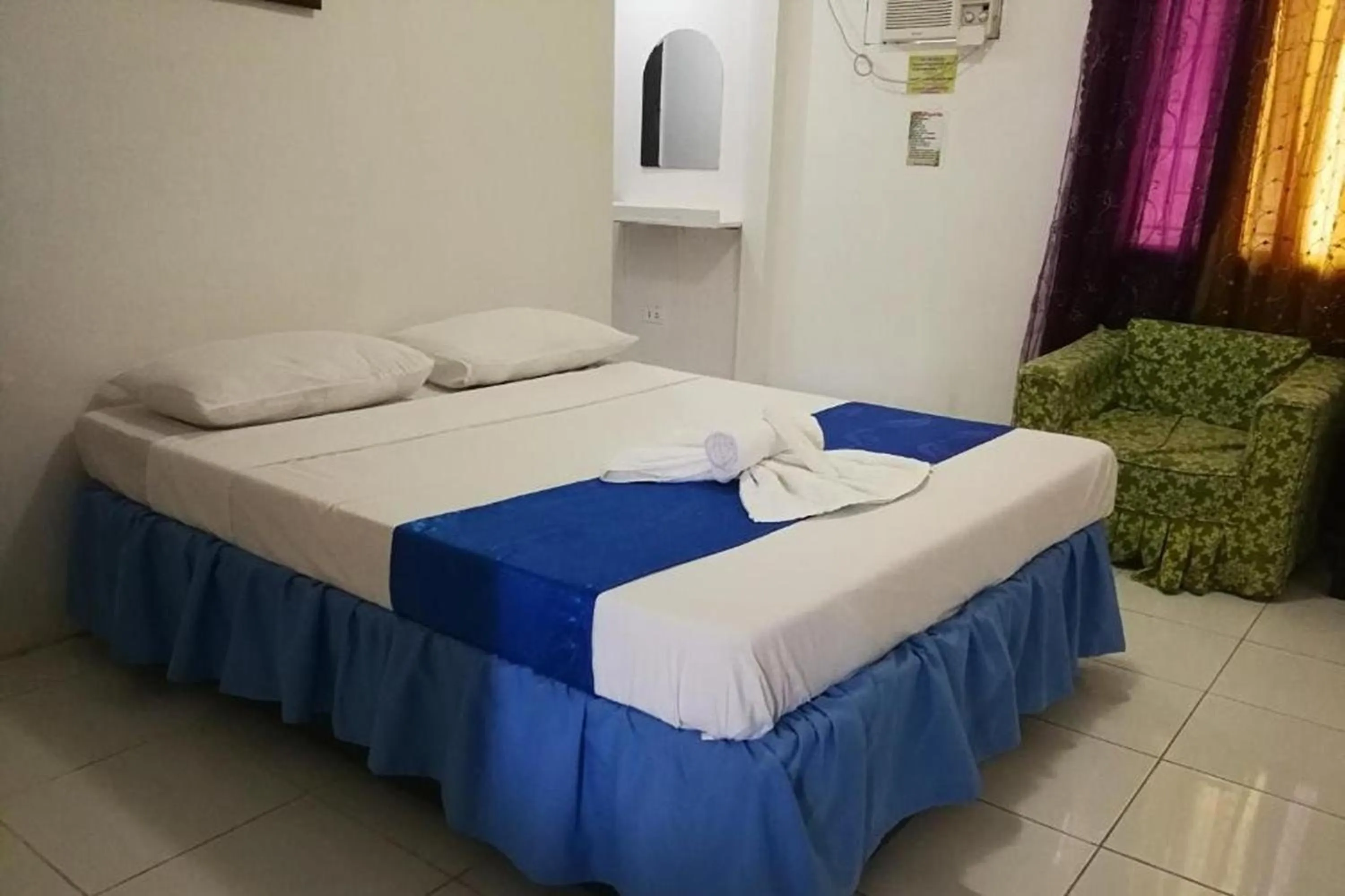 Bed in Bellevue Resort Puerto Galera