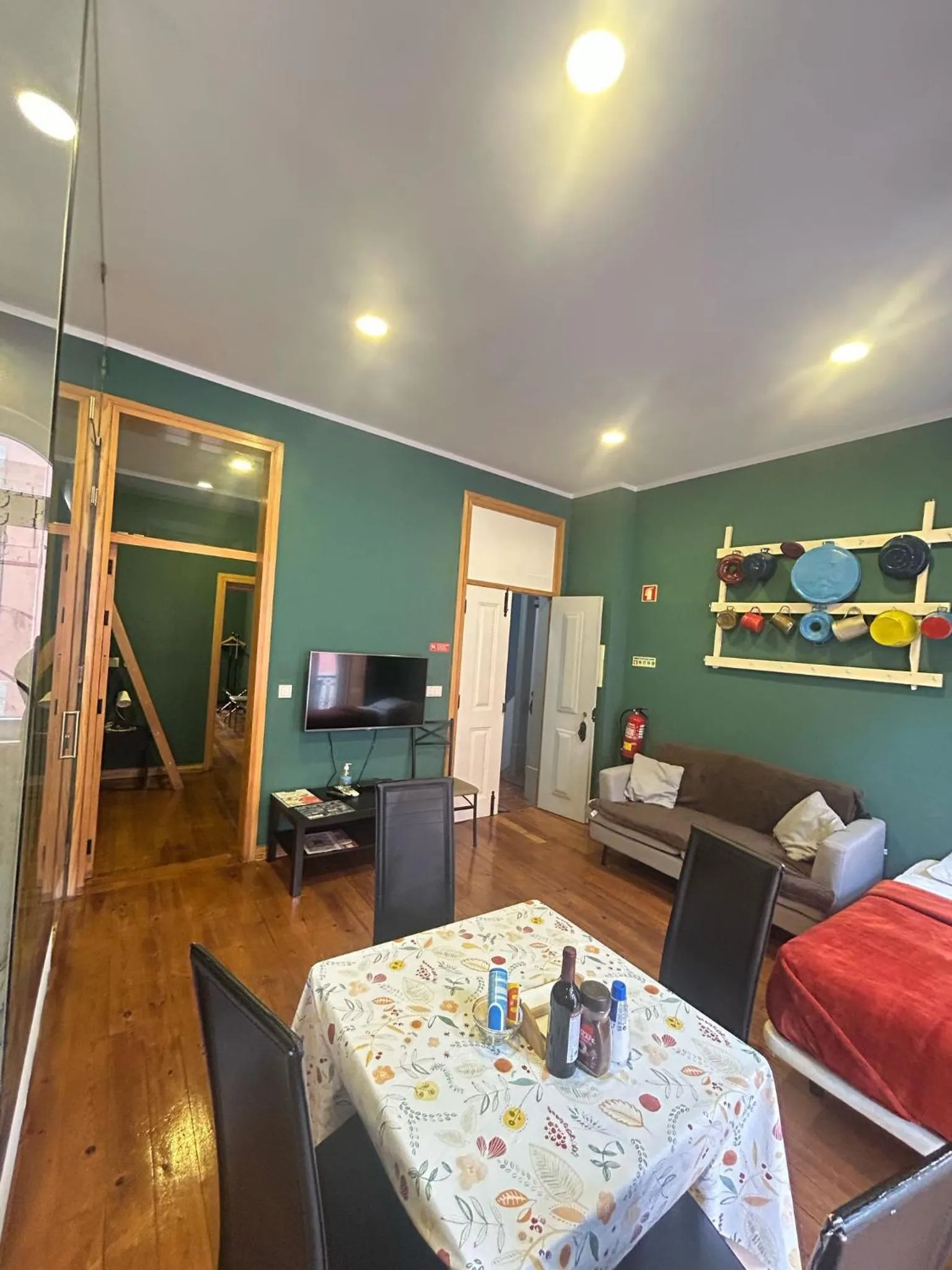 Communal lounge/ TV room, Bed in Sao Jorge Apartments & Suites