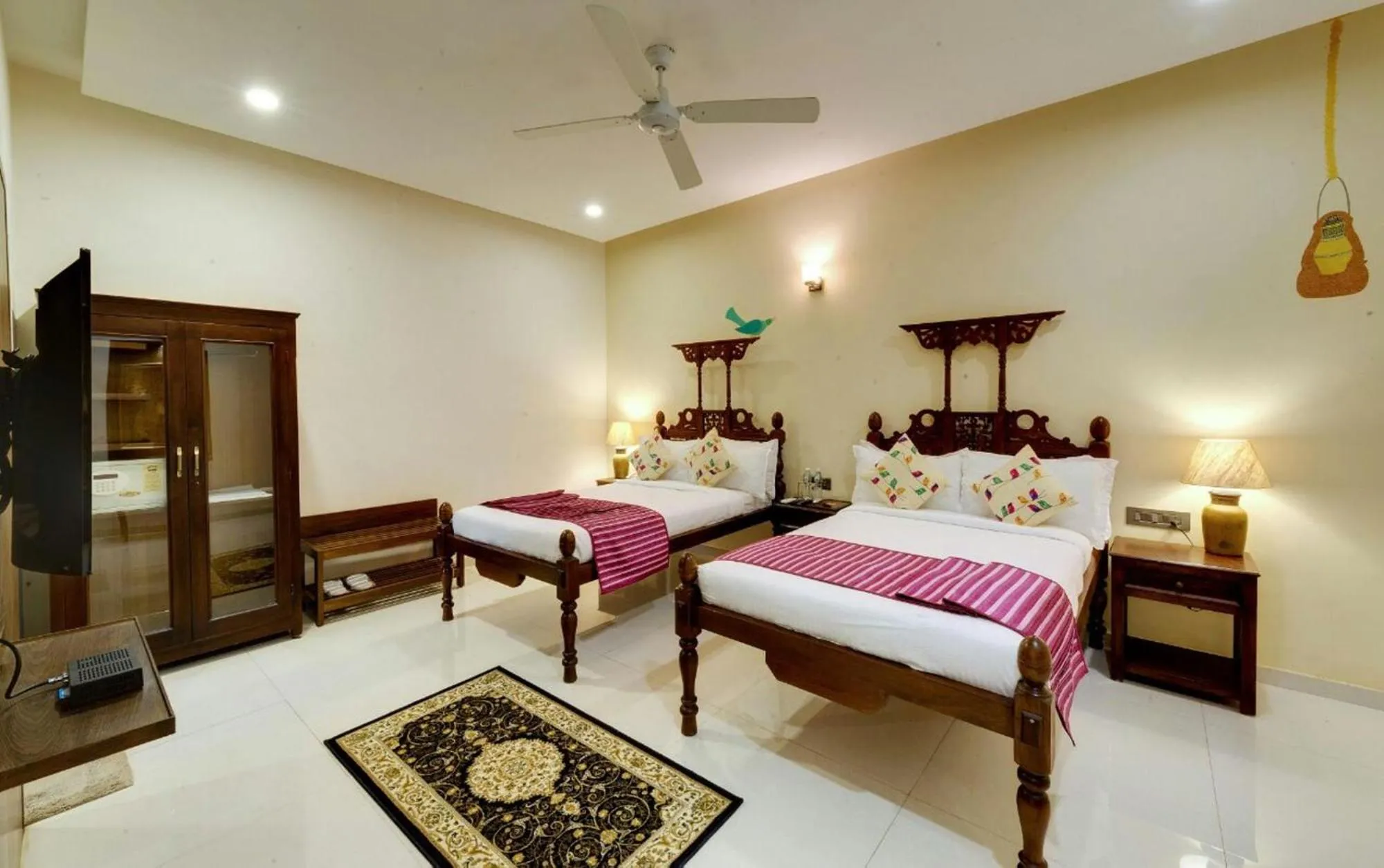 Bed in WelcomHeritage Mani Mansion