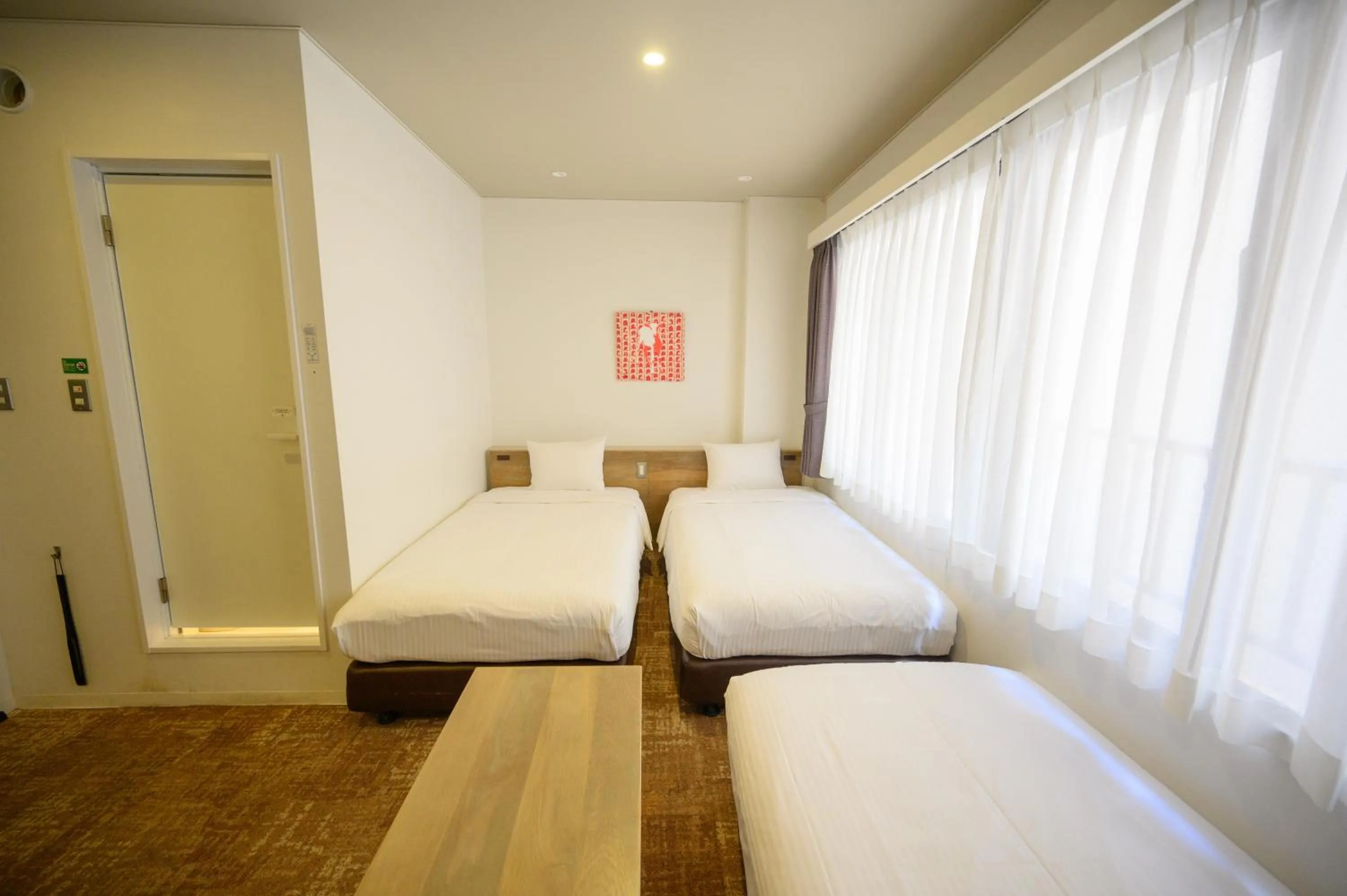 Photo of the whole room, Bed in Hotel Emerald Isle Ishigakijima