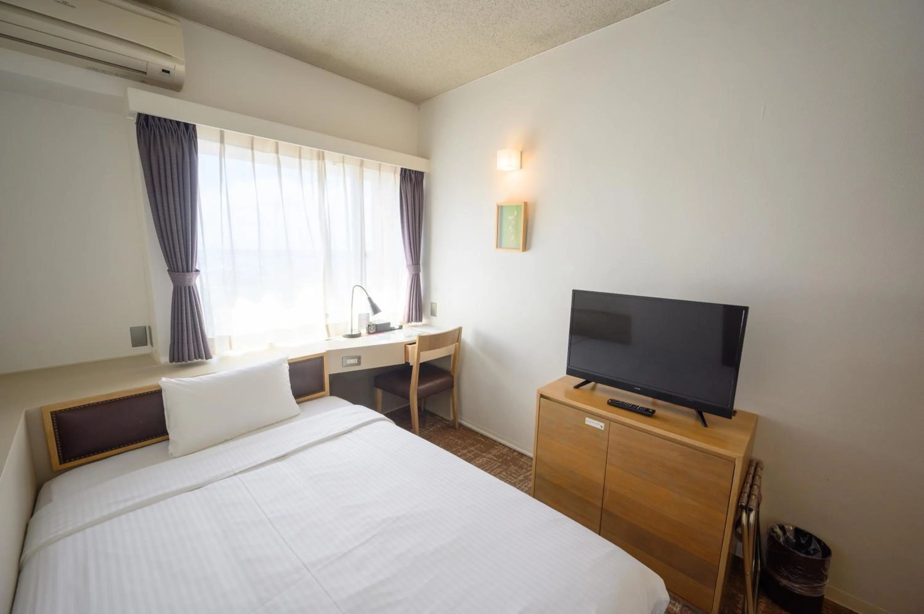 Photo of the whole room, Bed in Hotel Emerald Isle Ishigakijima