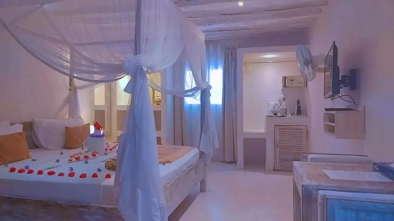 Bed in The Villa Luxury Suites Hotel