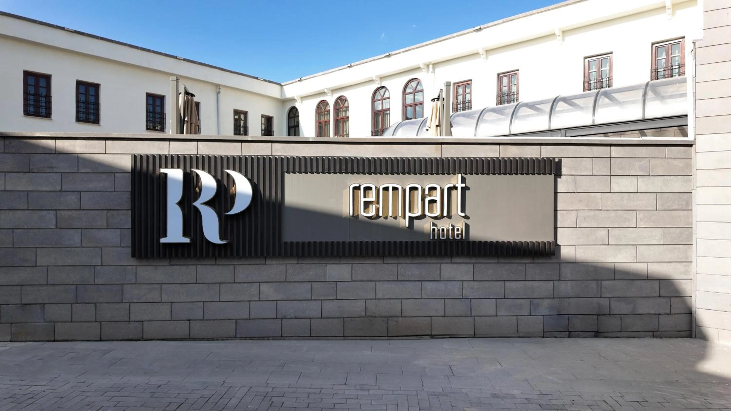 Property logo or sign in Rempart Hotel