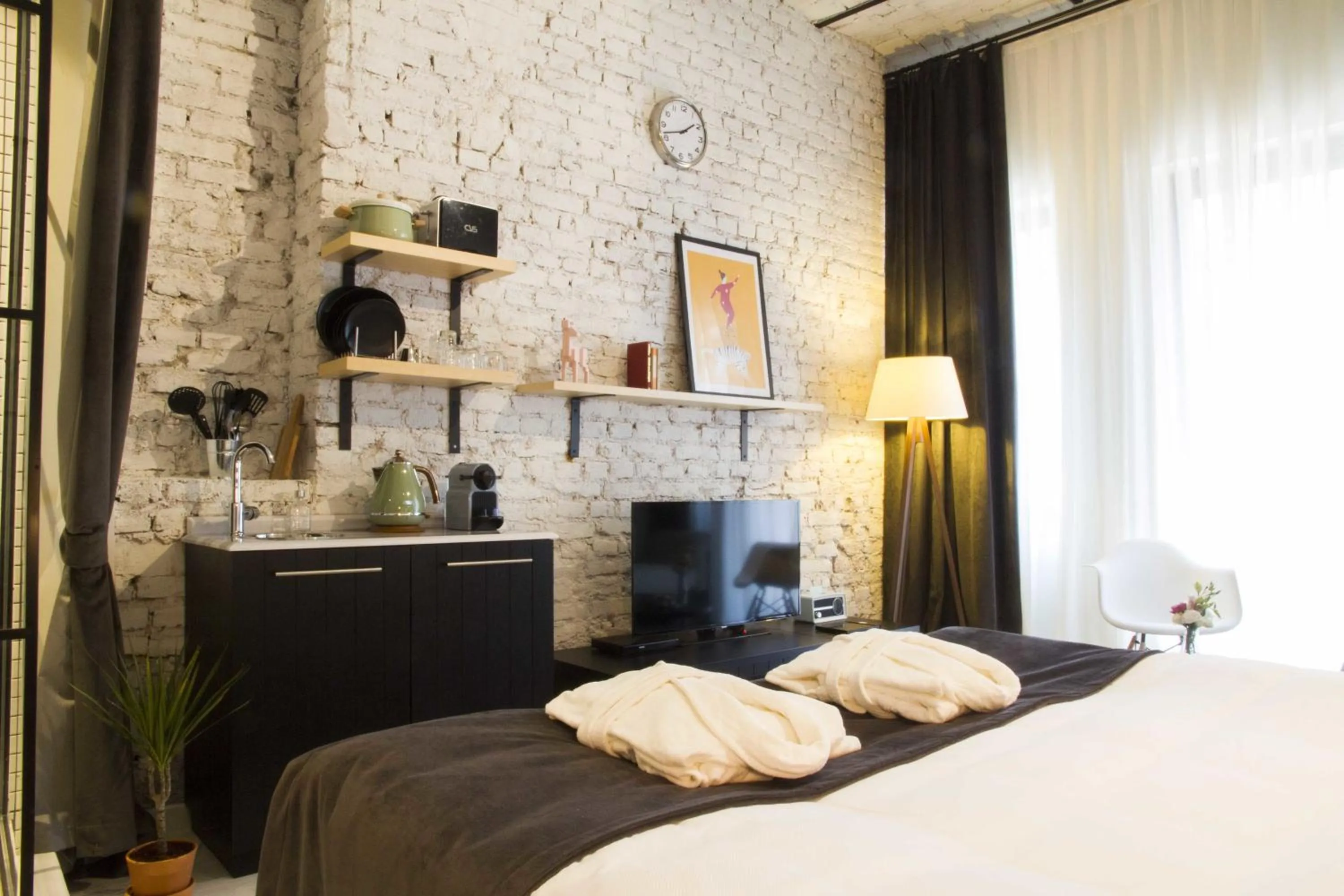 Photo of the whole room, Bed in Magnova Studios