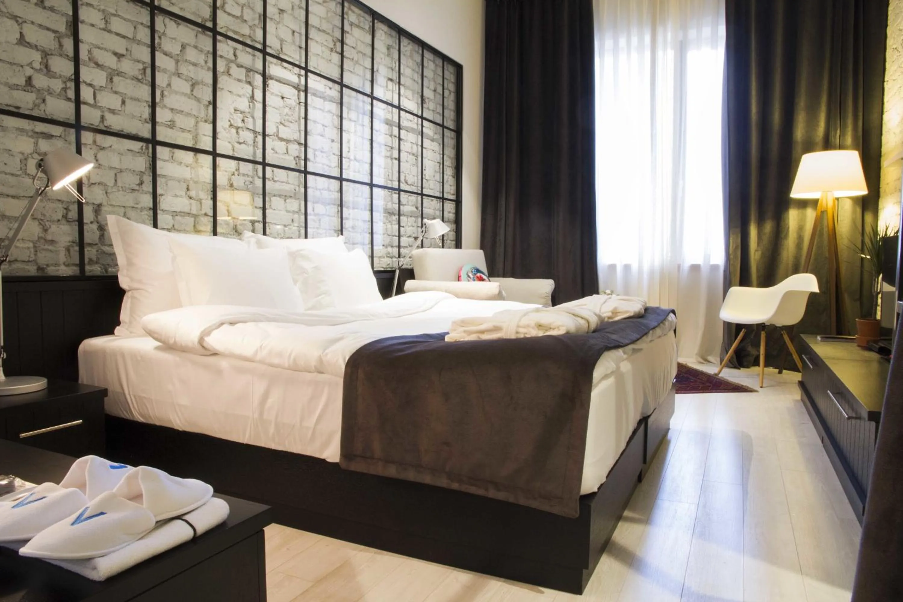 Photo of the whole room, Bed in Magnova Studios