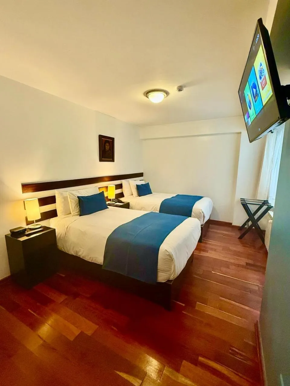 Communal lounge/ TV room, Bed in Wayqey Hotel