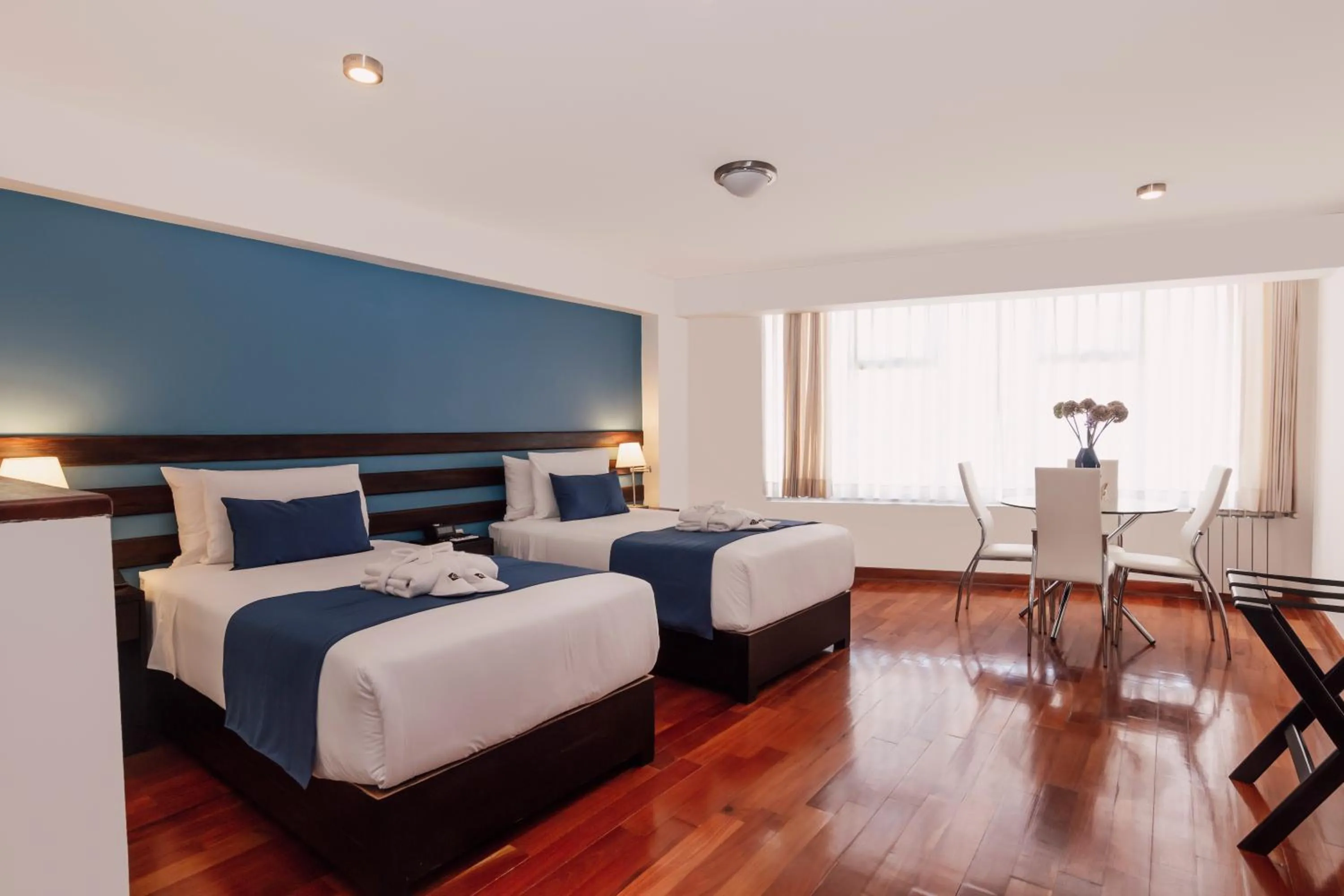 Seating area, Bed in Wayqey Hotel