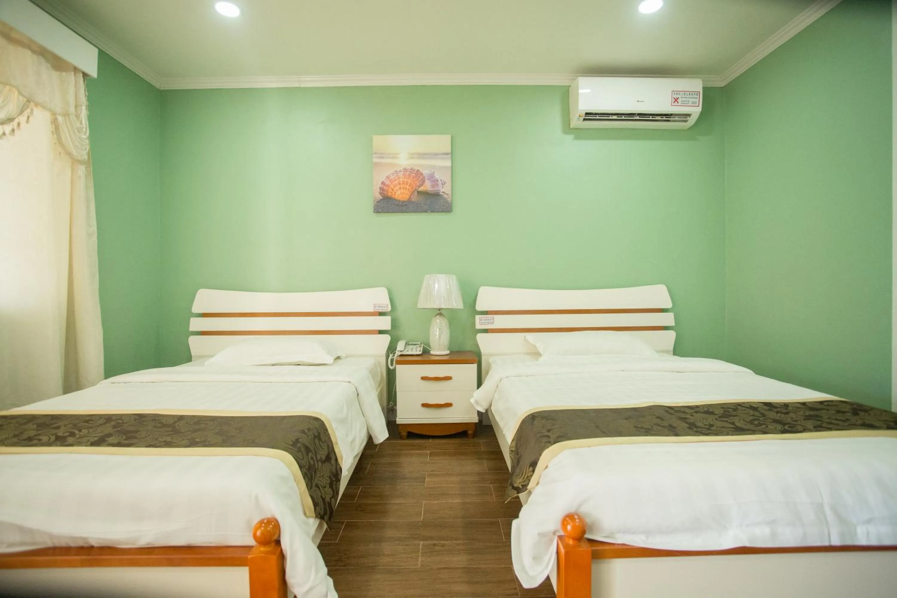 Bed in Beach Garden Hotel