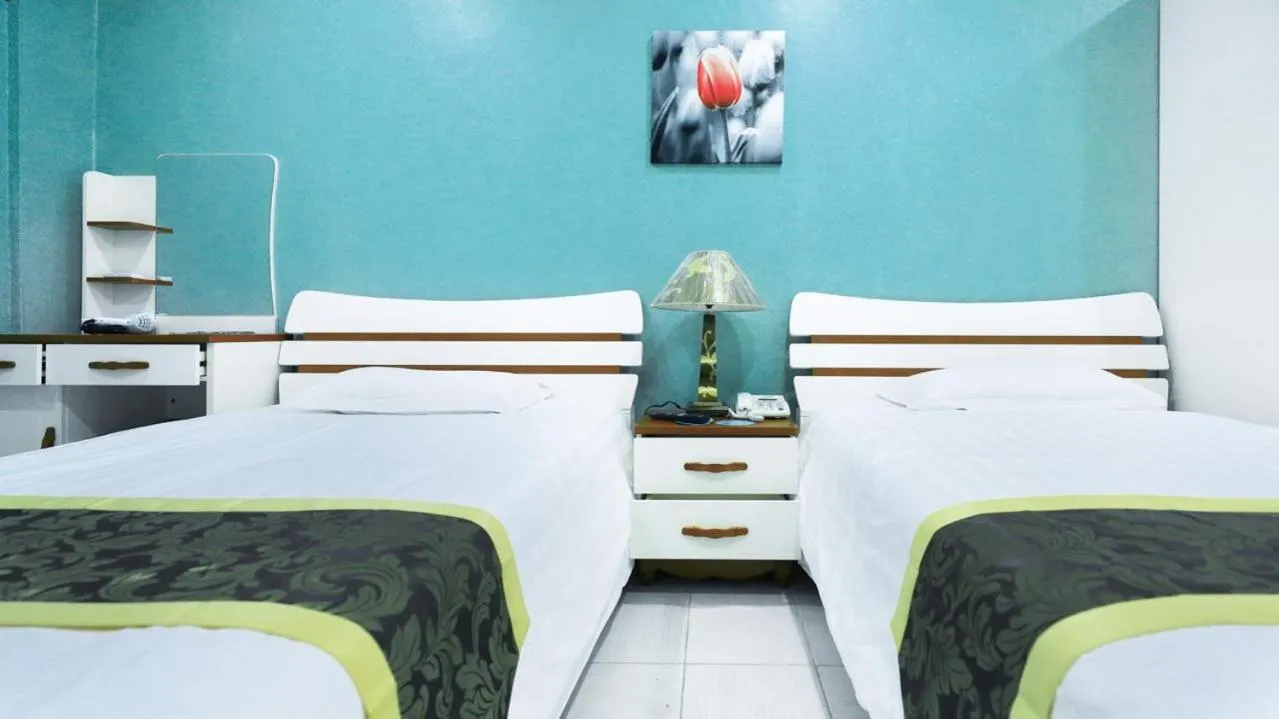 Bed in Beach Garden Hotel