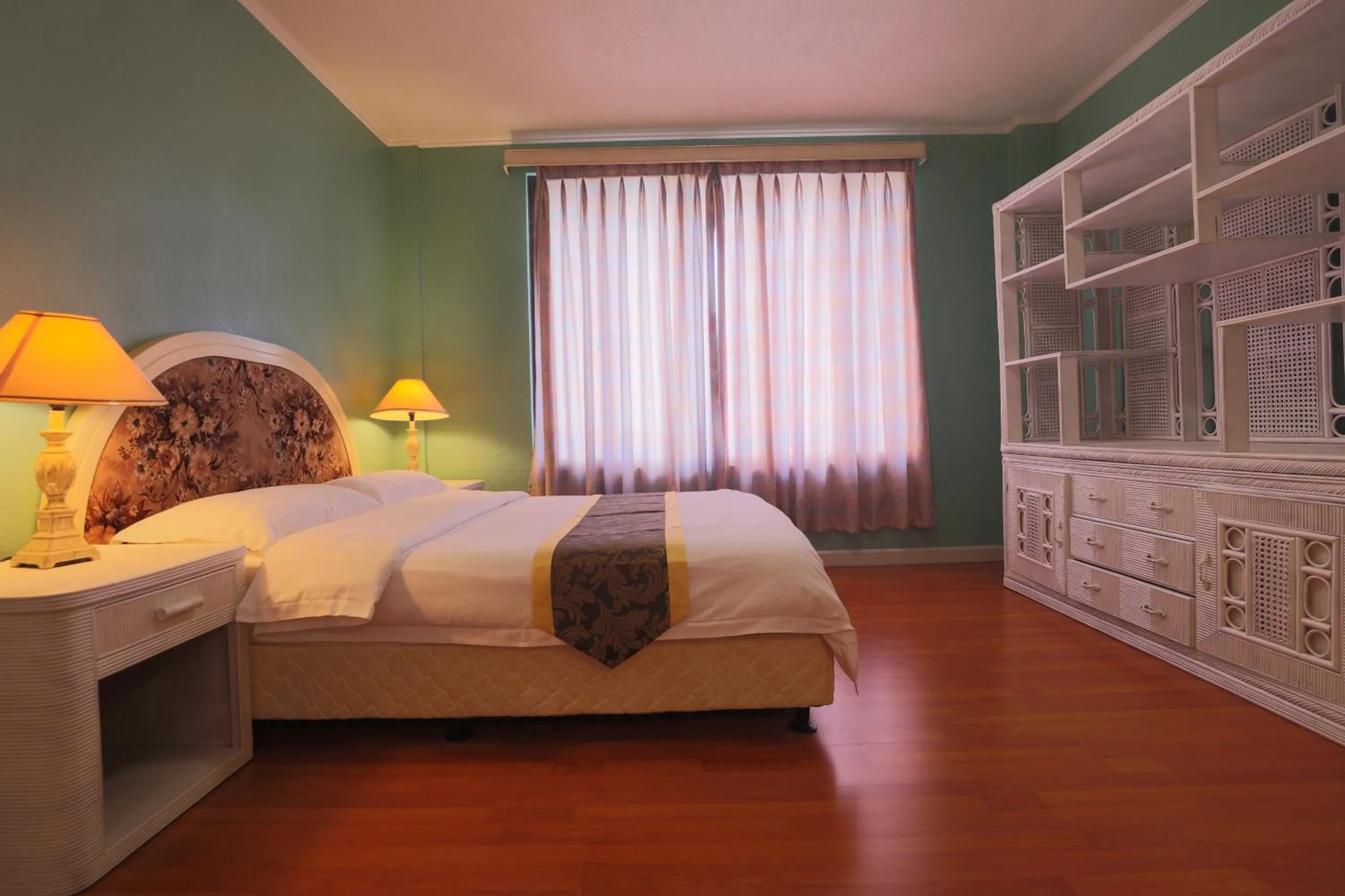 Bed in Beach Garden Hotel