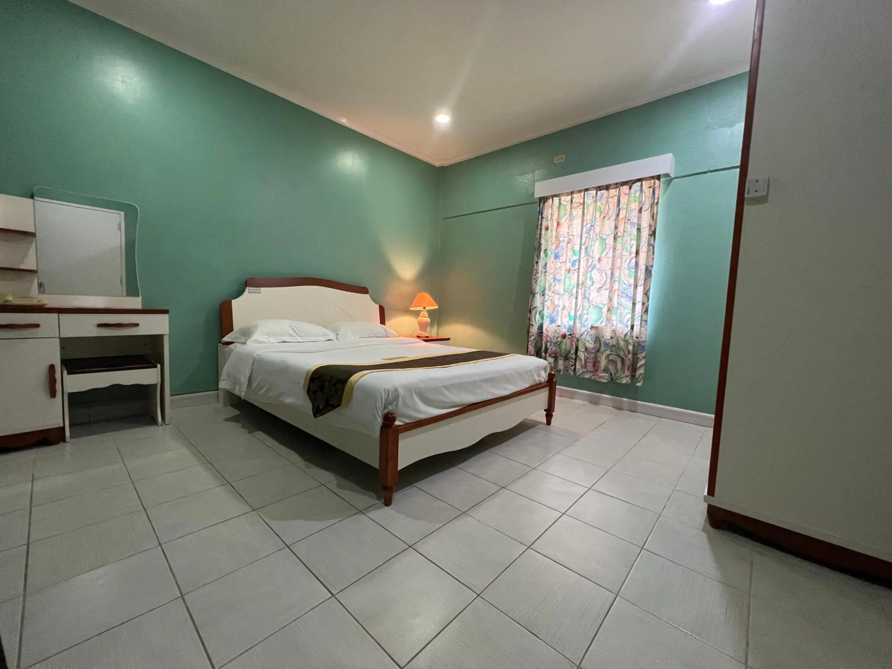 Bed in Beach Garden Hotel