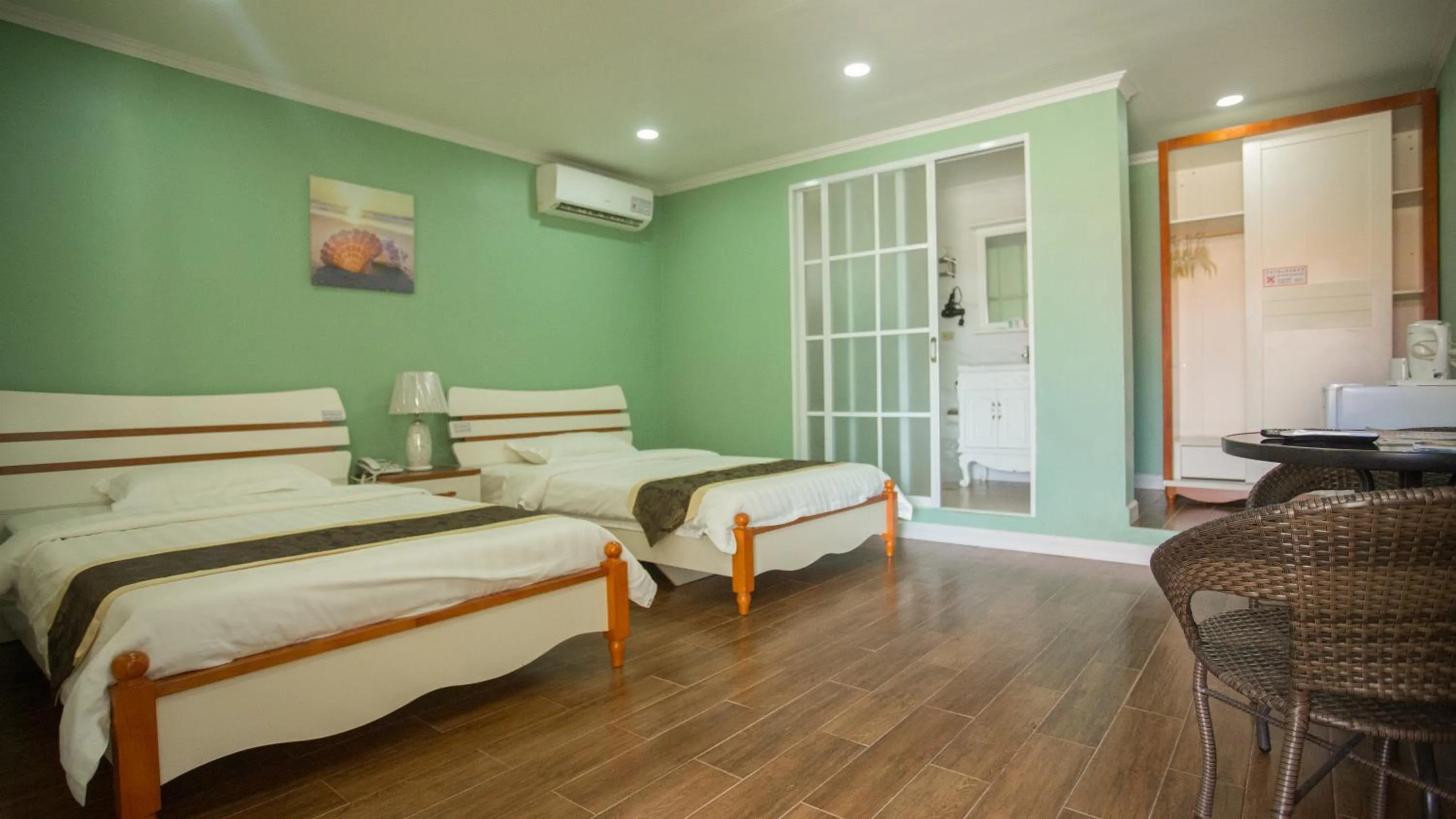 Bed in Beach Garden Hotel