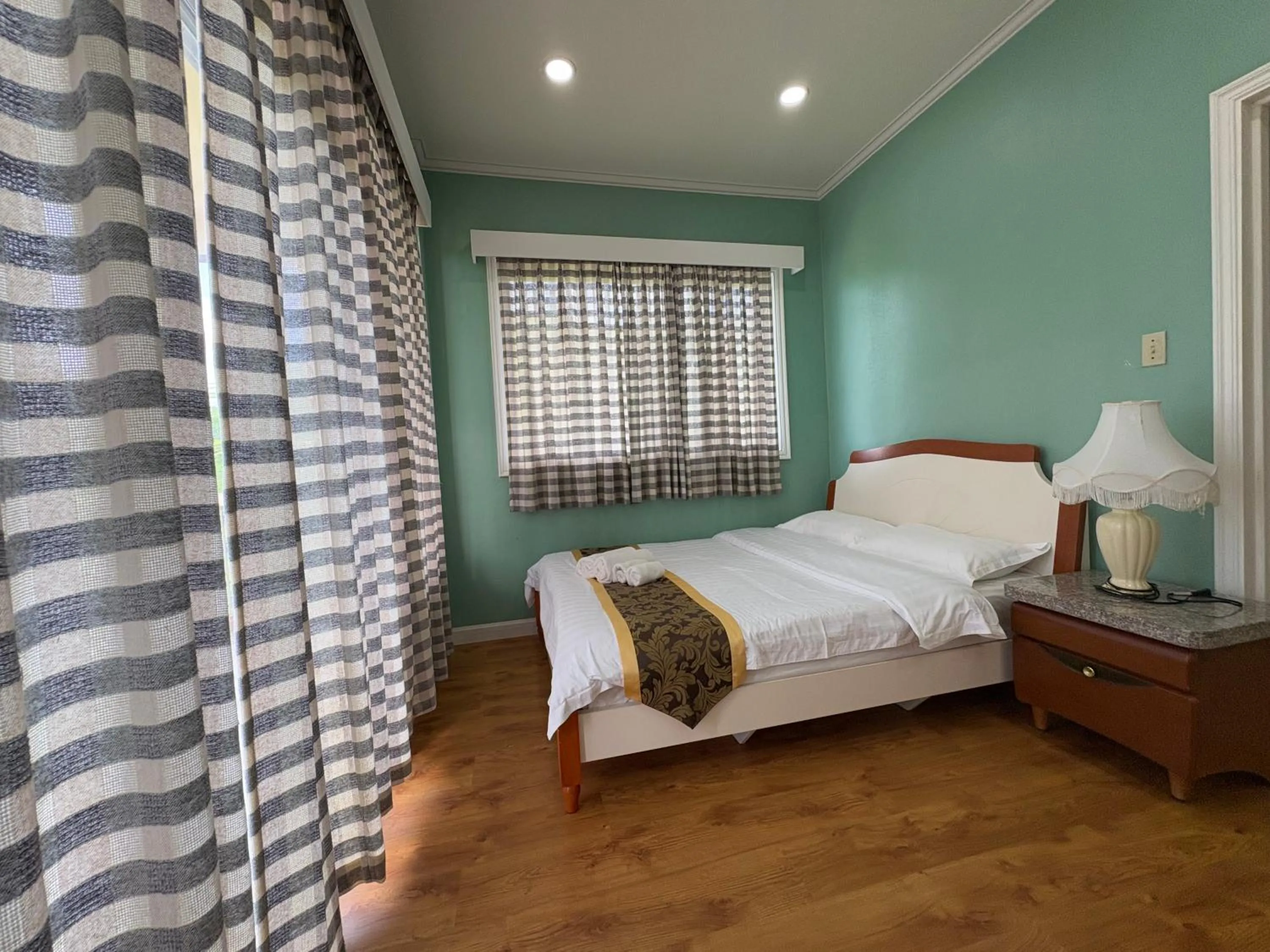 Bed in Beach Garden Hotel