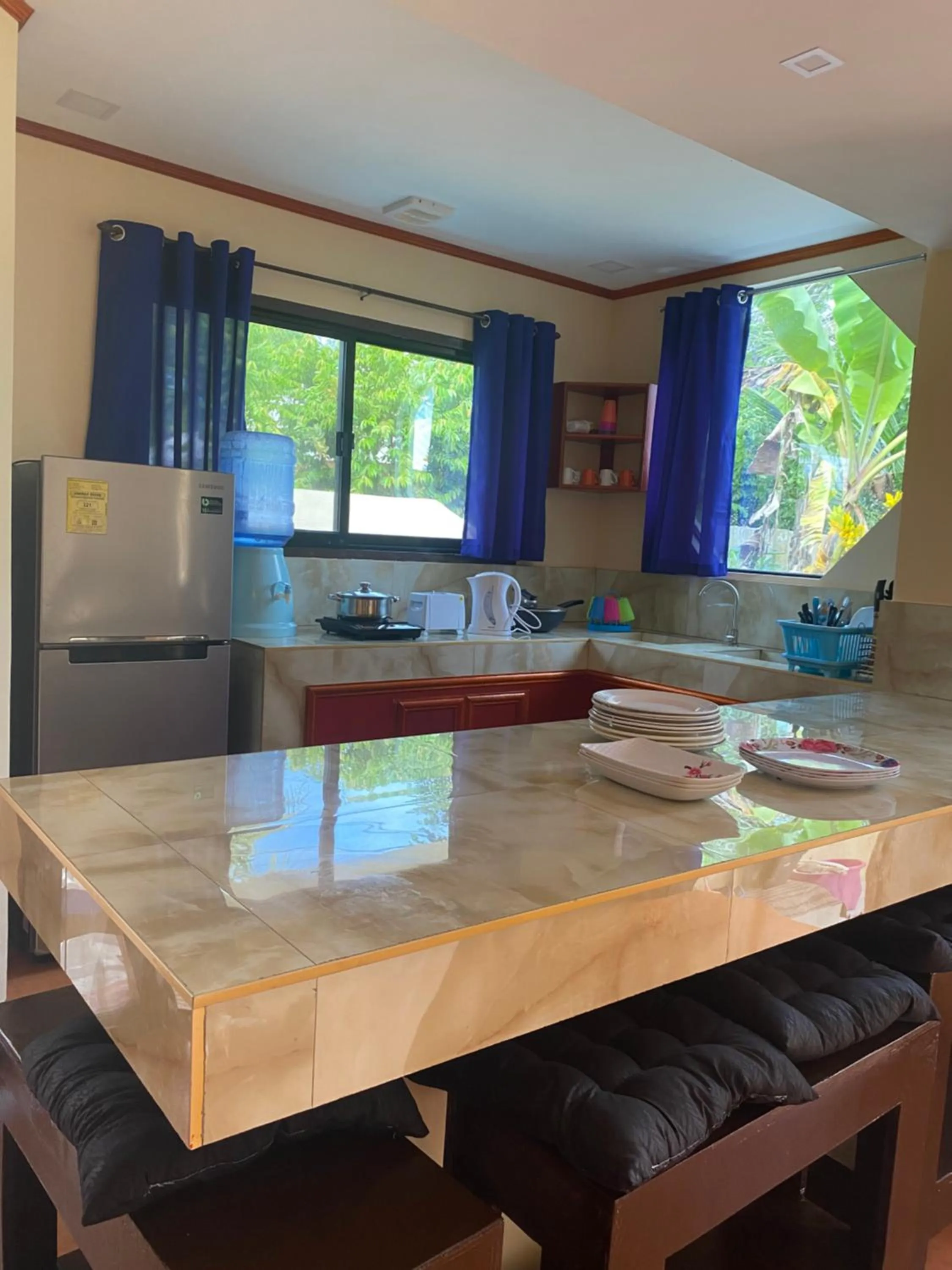 Kitchen or kitchenette in Siargao Sunset Bay Beach Villas
